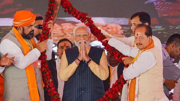 <div class="paragraphs"><p>Prime Minister Narendra Modi being garlanded during the inauguration and foundation stone laying ceremony of various development projects, at Bettiah in West Champaran district, Wednesday, March 6, 2024. Bihar Deputy CMs Vijay Kumar Sinha and Samrat Chaudhary are also seen.</p></div>