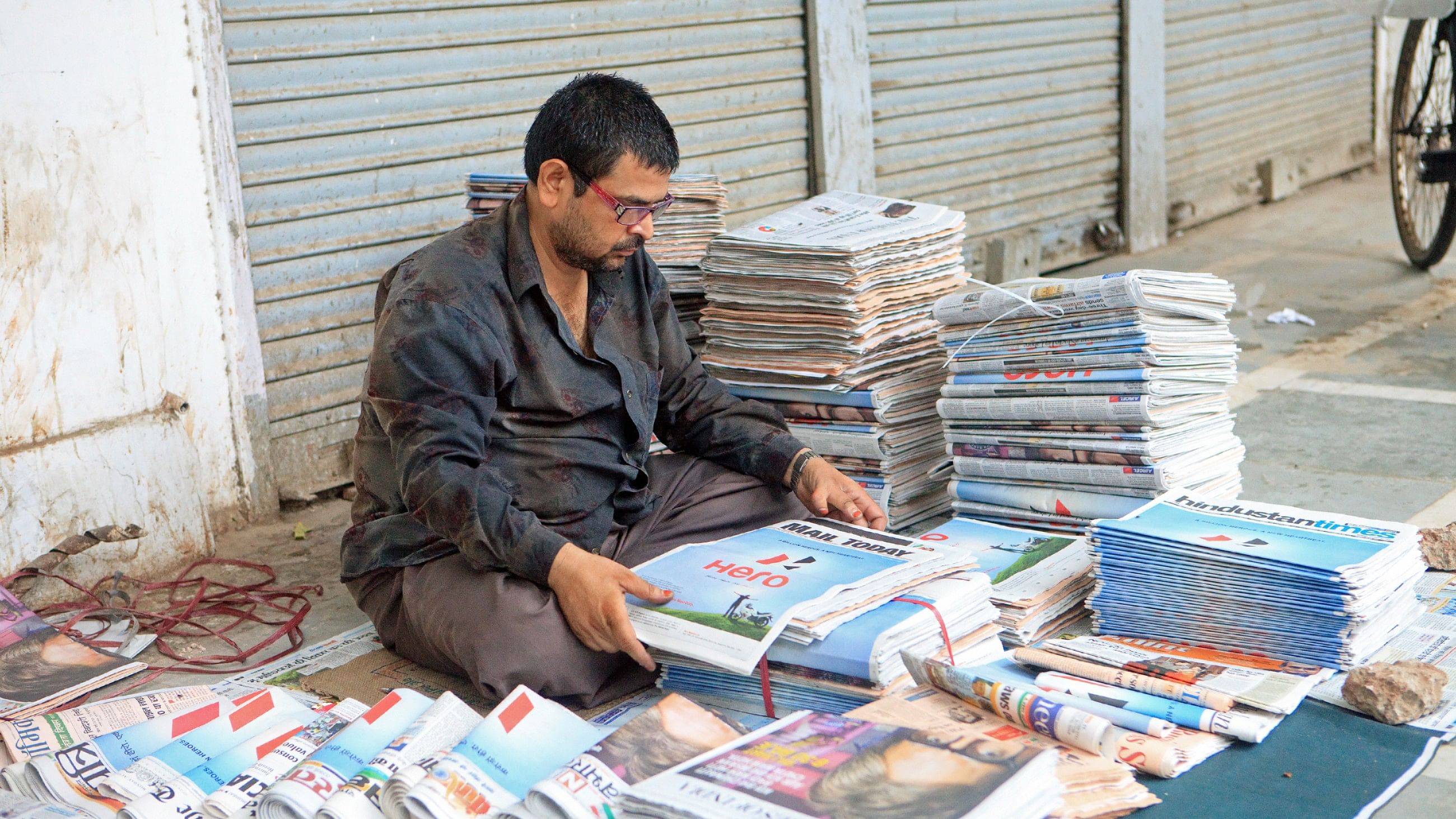 <div class="paragraphs"><p>A newspaper vendor seen at a roadside in Delhi.&nbsp;</p></div>