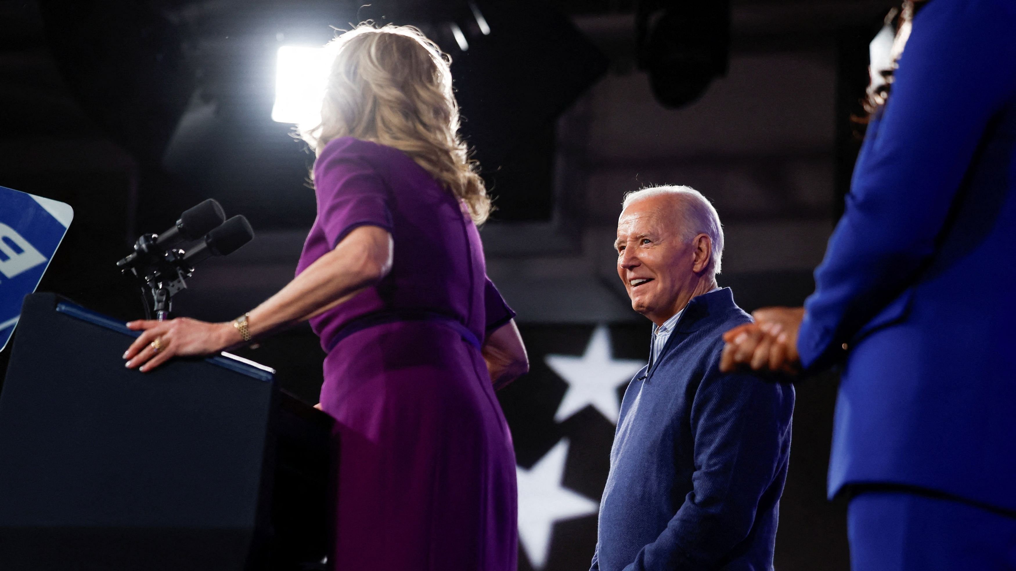 <div class="paragraphs"><p>US President Joe Biden looks on as first lady Jill Biden speaks during a campaign event at Strath Haven Middle School in Wallingford, Pennsylvania, U.S, March 8, 2024. </p></div>