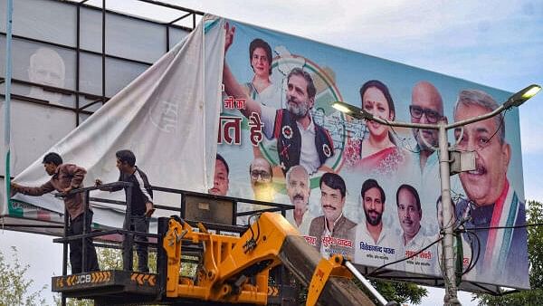 <div class="paragraphs"><p>Workers remove posters of political leaders after the Model Code of Conduct was enforced following the announcement of the schedule of Lok Sabha elections, in Prayagraj (Allahabad), Saturday, March 16, 2024. </p></div>