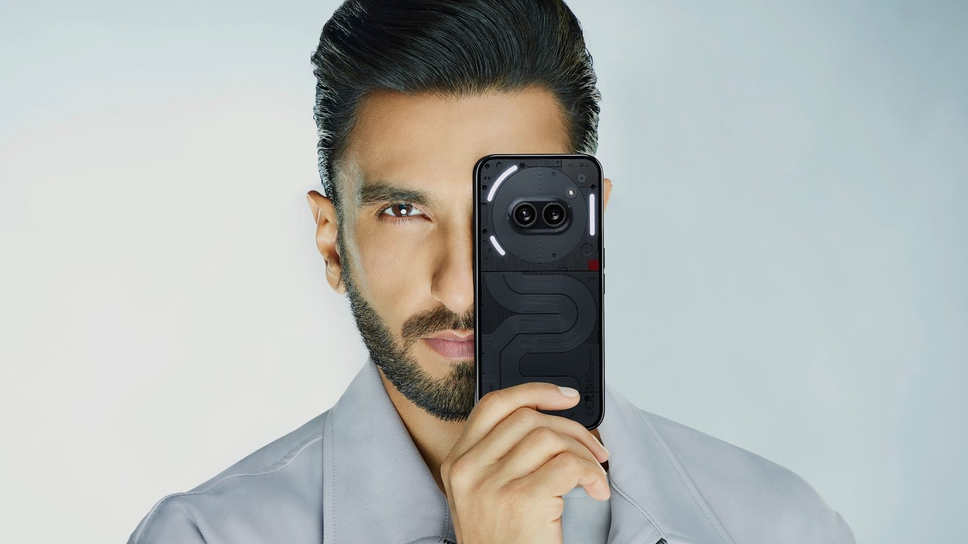 <div class="paragraphs"><p>Brand ambassador Ranveer Singh with&nbsp;Nothing Phone 2(a).</p></div>