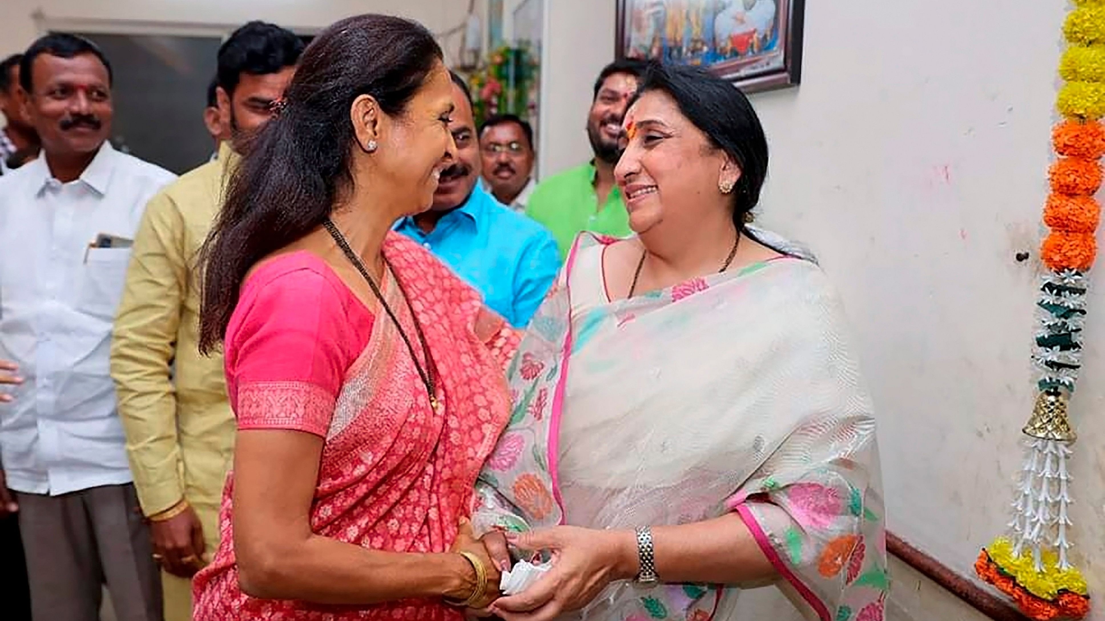<div class="paragraphs"><p>NCP leader Supriya Sule and Ajit Pawar's wife Sunetra Pawar meet at a temple in Baramati tehsil, in Pune district, Friday, March 8, 2024. </p></div>