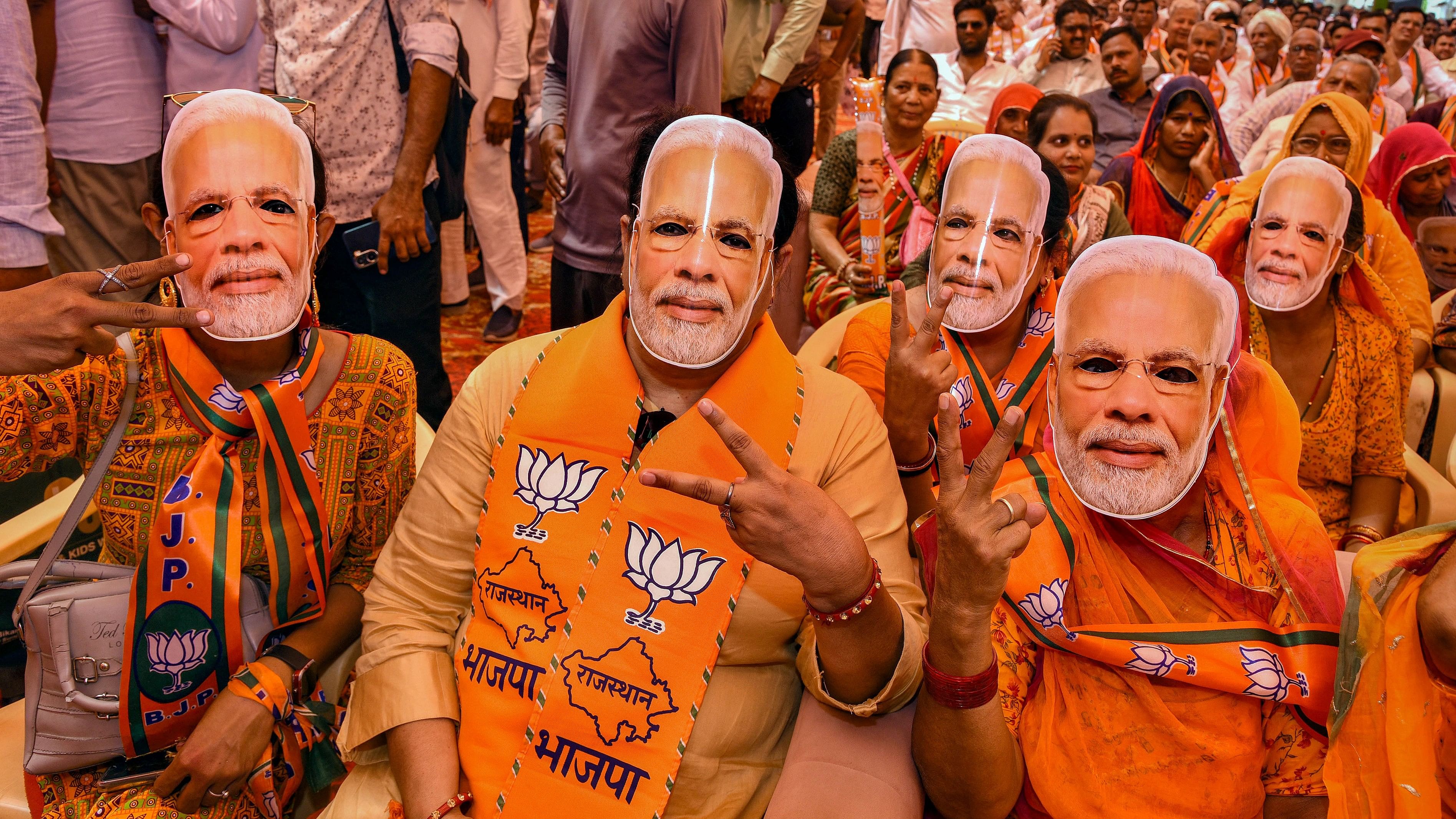 <div class="paragraphs"><p>BJP supporters wear masks of Prime Minister Narendra Modi</p></div>