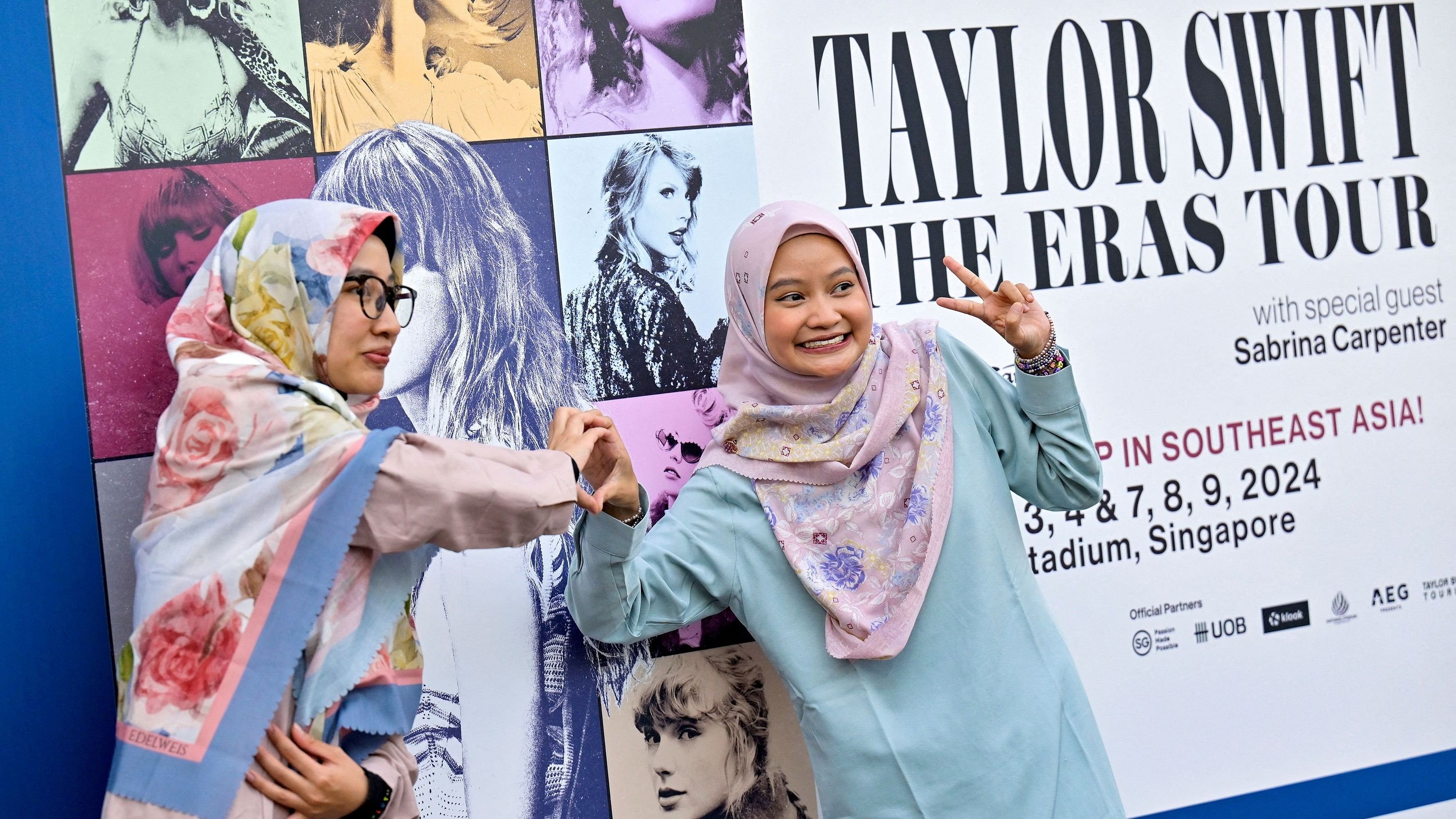 <div class="paragraphs"><p>Taylor Swift's fans, or Swifties, pose for a picture at the National Stadium during Swift's Eras Tour concert in Singapore</p></div>