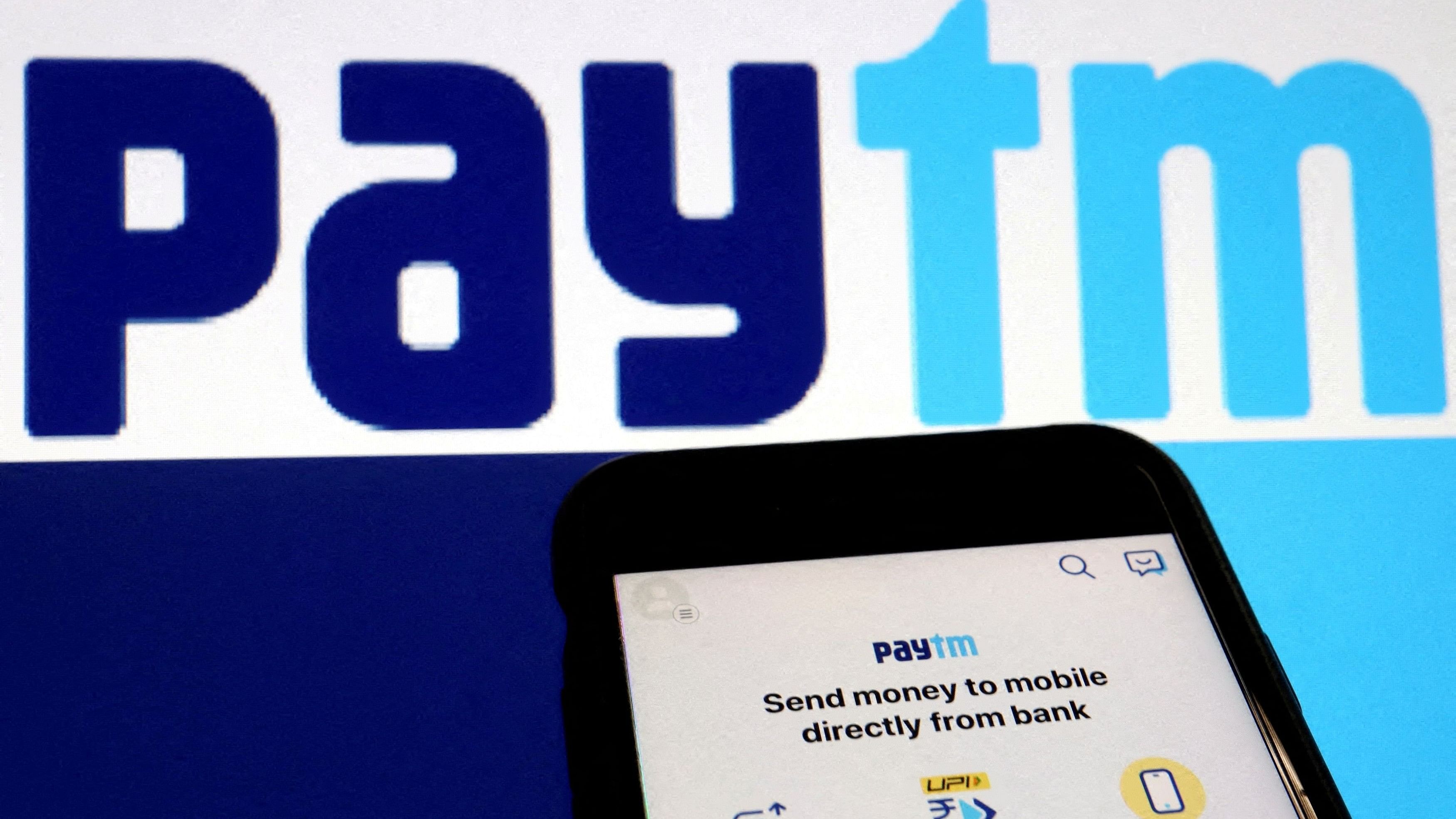 <div class="paragraphs"><p>The interface of Indian payments app Paytm is seen in front of its logo displayed in this illustration </p></div>