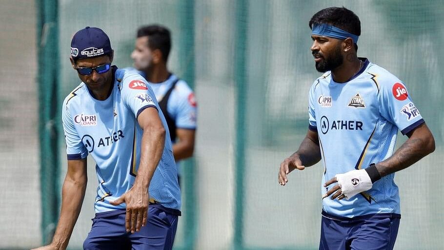 <div class="paragraphs"><p>Hardik Pandya with Gujarat Titans head coach Ashish Nehra during a practice session</p></div>