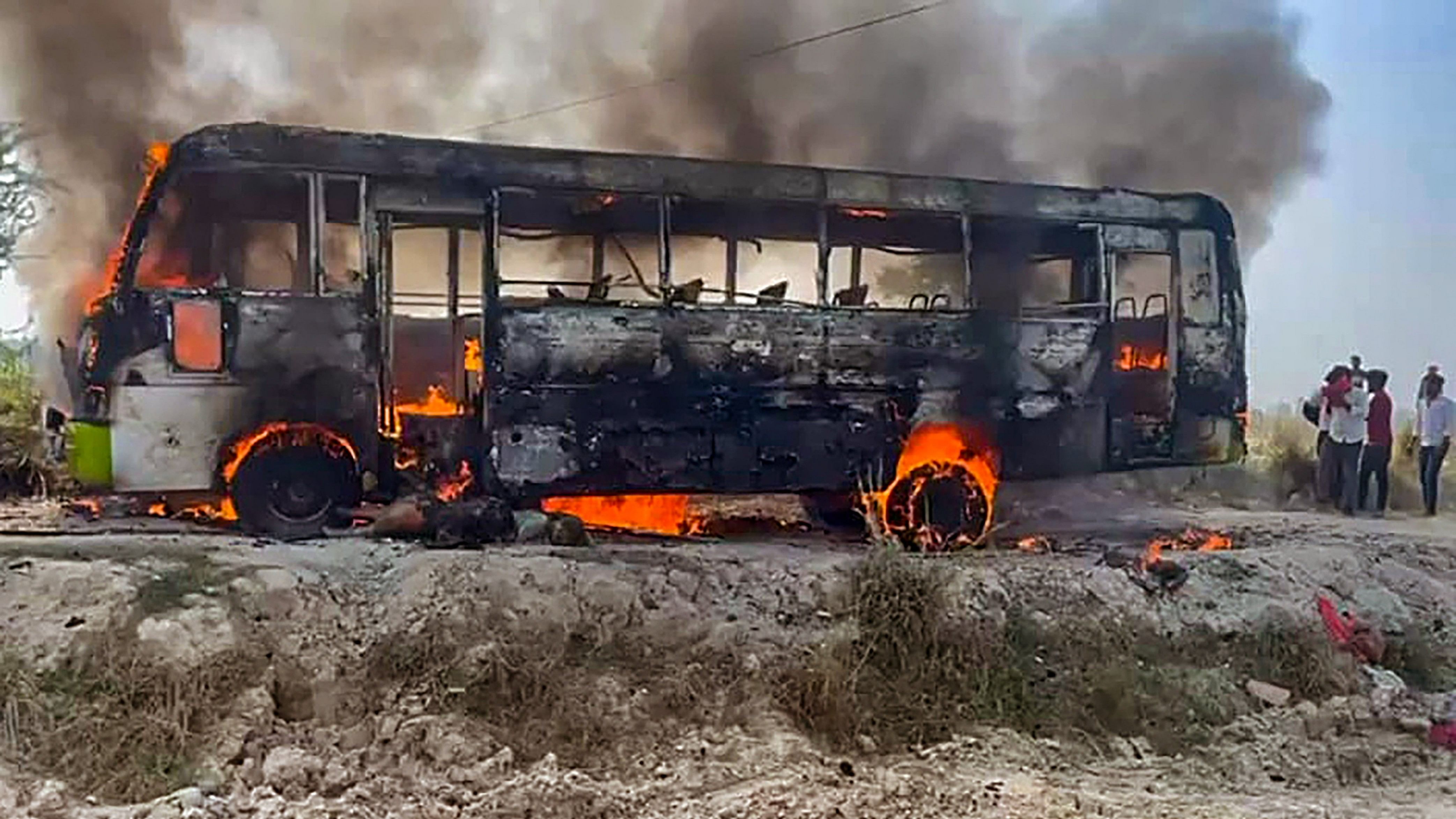 <div class="paragraphs"><p>Ghazipur: Smoke billows after a bus came in contact with a live wire and caught fire, in Ghazipur district, Monday, March 11, 2024. </p></div>