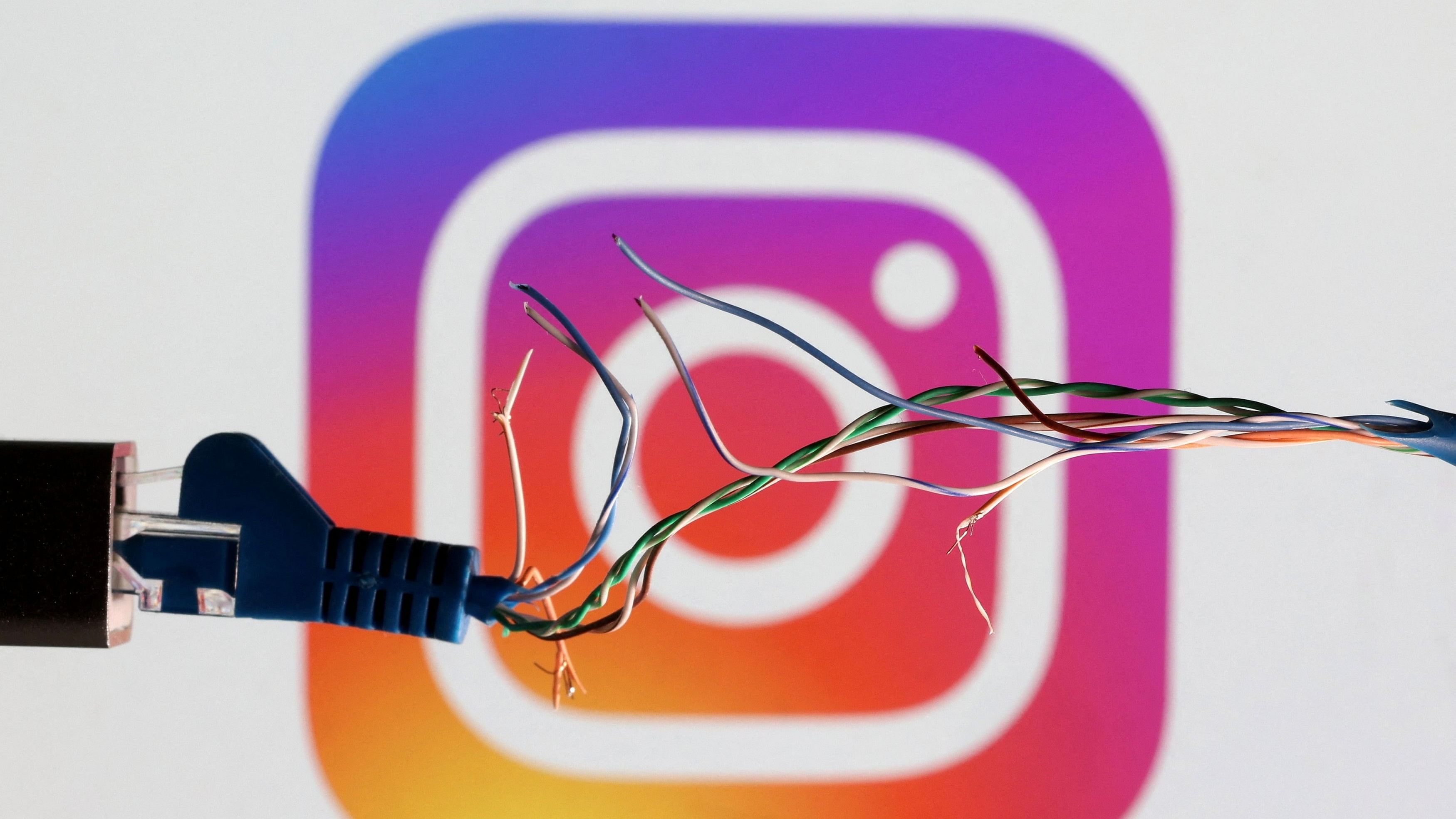 <div class="paragraphs"><p>FILE PHOTO: Broken Ethernet cable is seen in front of Instagram logo in this illustration.</p></div>