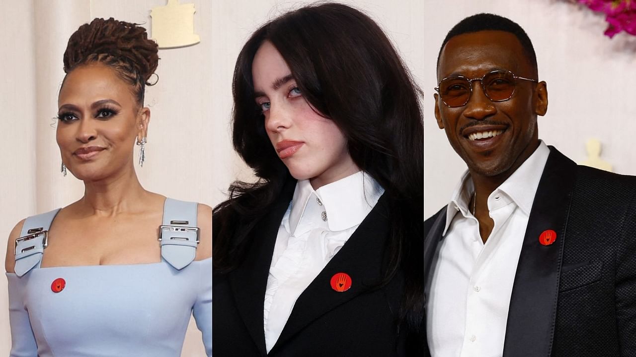 <div class="paragraphs"><p>Director&nbsp;Ava DuVernay, Billie Eilish and Mahershala Ali wearing red pins at the 96th Academy Awards.&nbsp;</p></div>