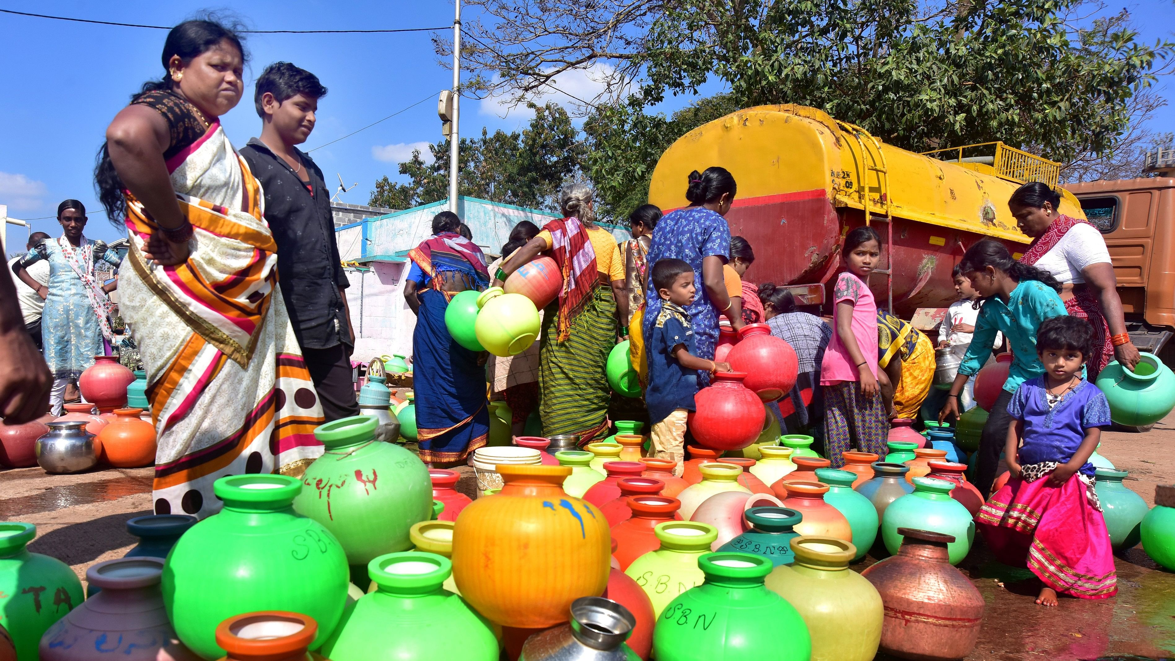 <div class="paragraphs"><p>People collect water from a tanker in Amargol, Hubballi.</p></div>