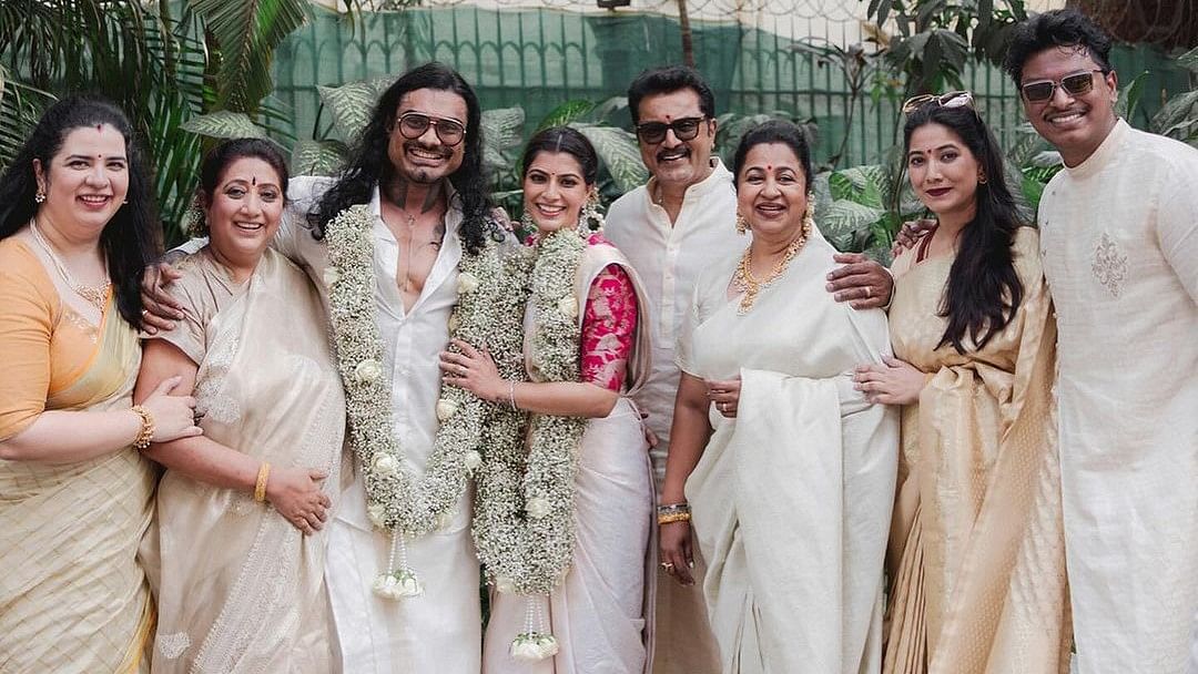 <div class="paragraphs"><p>Varalaxmi Sarathkumar and Nicholai Sachdev pose with their family members during their engagement.</p></div>