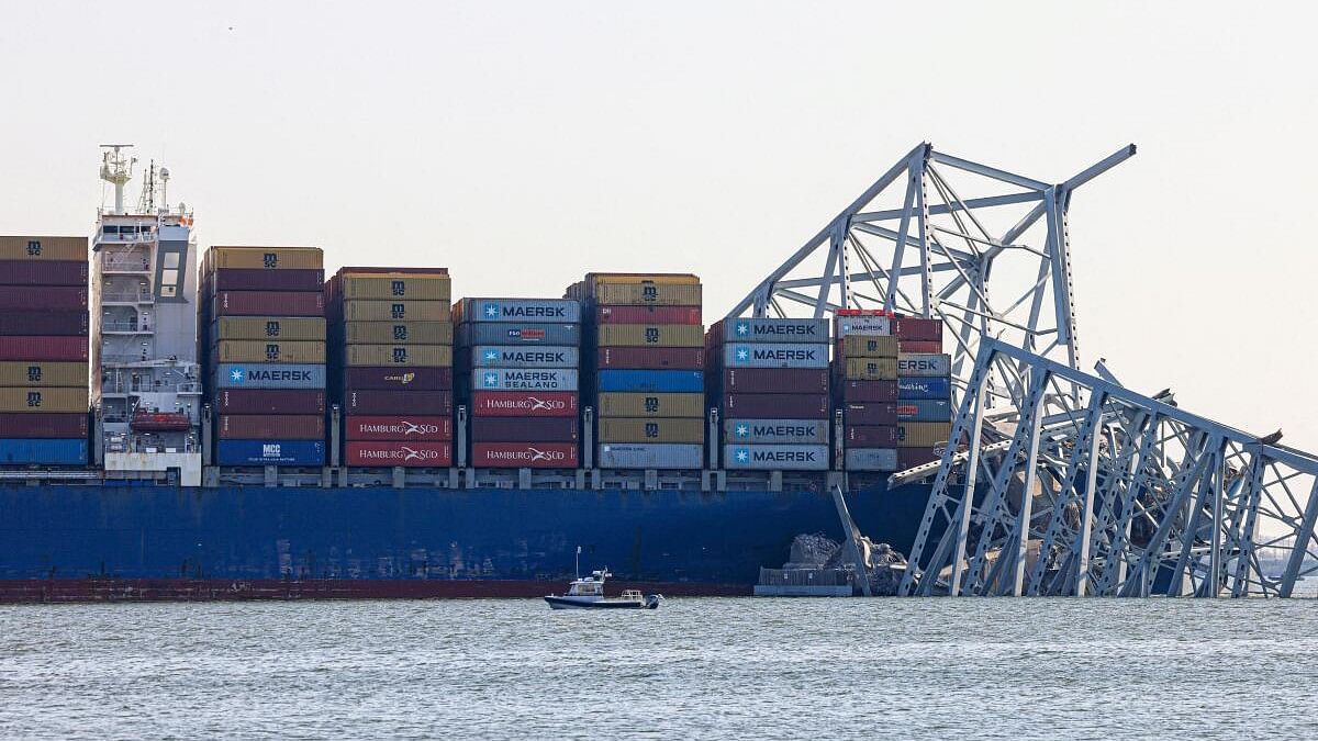 <div class="paragraphs"><p>Wreckage lies across the deck of the Dali cargo vessel, which crashed into the Francis Scott Key Bridge causing it to collapse in Baltimore.</p></div>