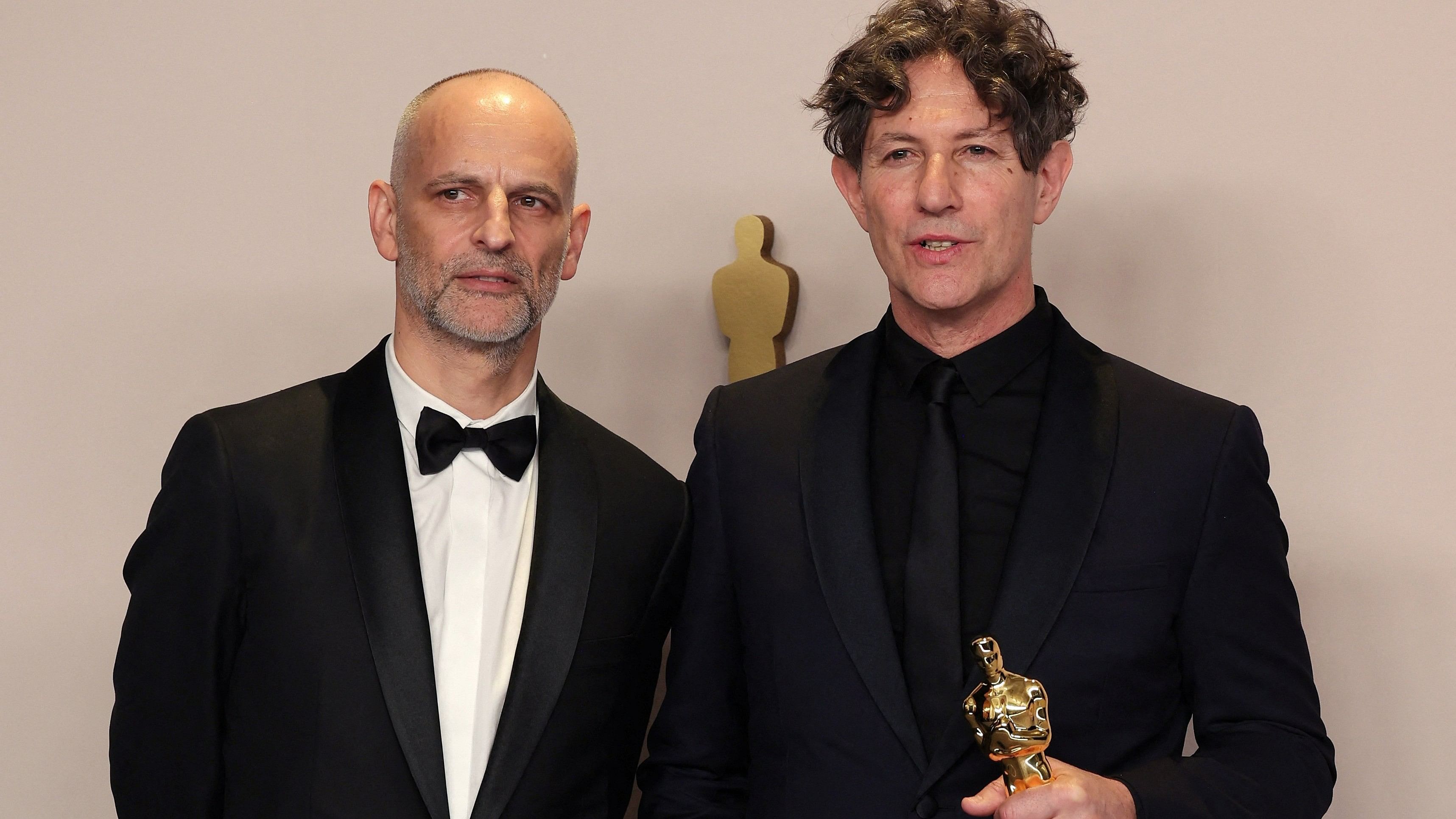 <div class="paragraphs"><p>Director Jonathan Glazer poses alongside producer James Wilson with the Oscar for Best International Feature Film for "The Zone of Interest" of United Kingdom in the Oscars photo room at the 96th Academy Awards in Hollywood, Los Angeles, California, US, March 10, 2024.</p></div>