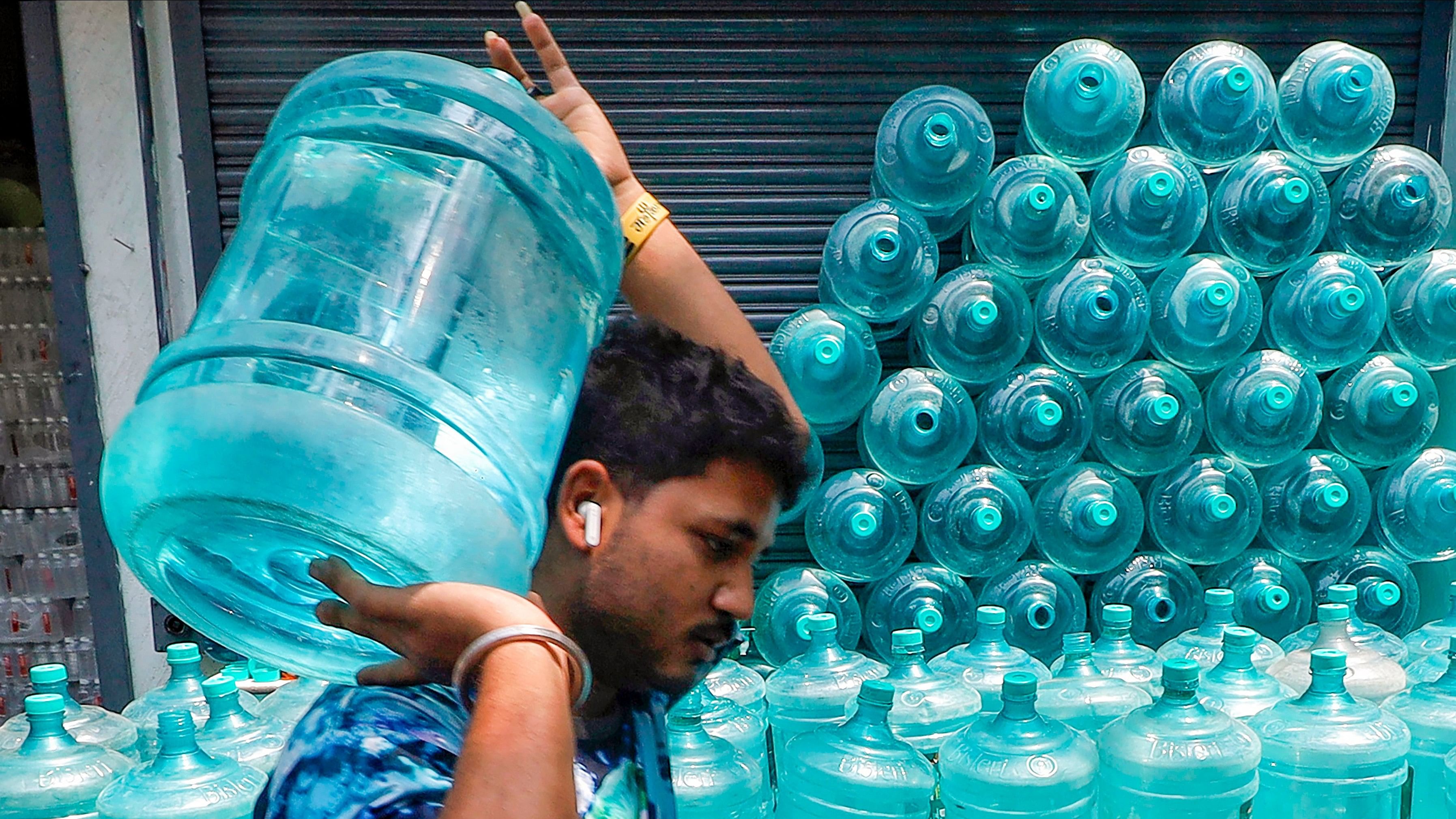 <div class="paragraphs"><p>A man carries a drinking water can in Bengaluru on Monday.&nbsp;The city needs 2,600 MLD of water for both drinking and industrial purposes. </p></div>