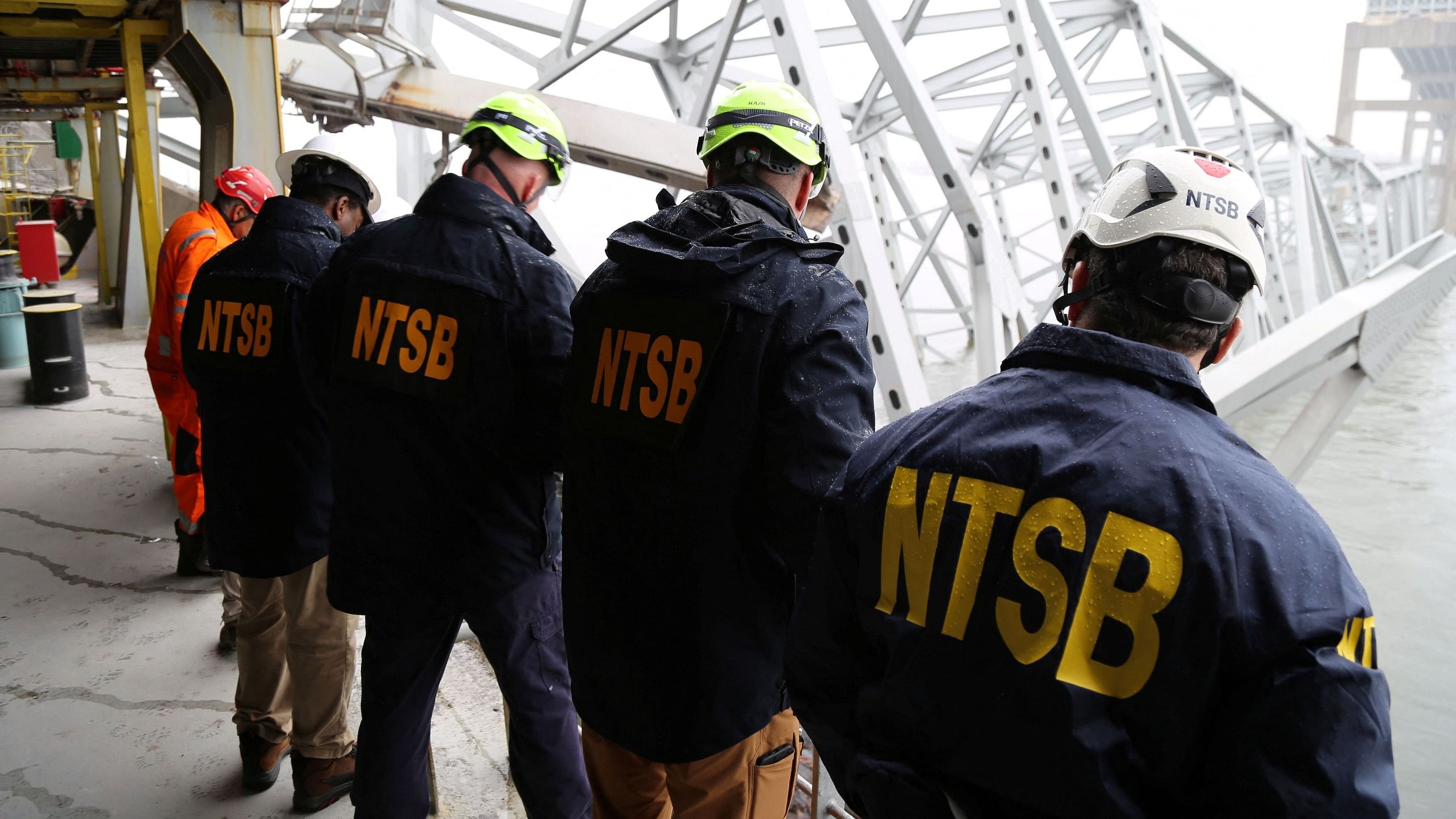 <div class="paragraphs"><p>National Transportation Safety Board (NTSB) investigators work on the cargo vessel Dali, which struck and collapsed the Francis Scott Key Bridge, in Baltimore</p></div>