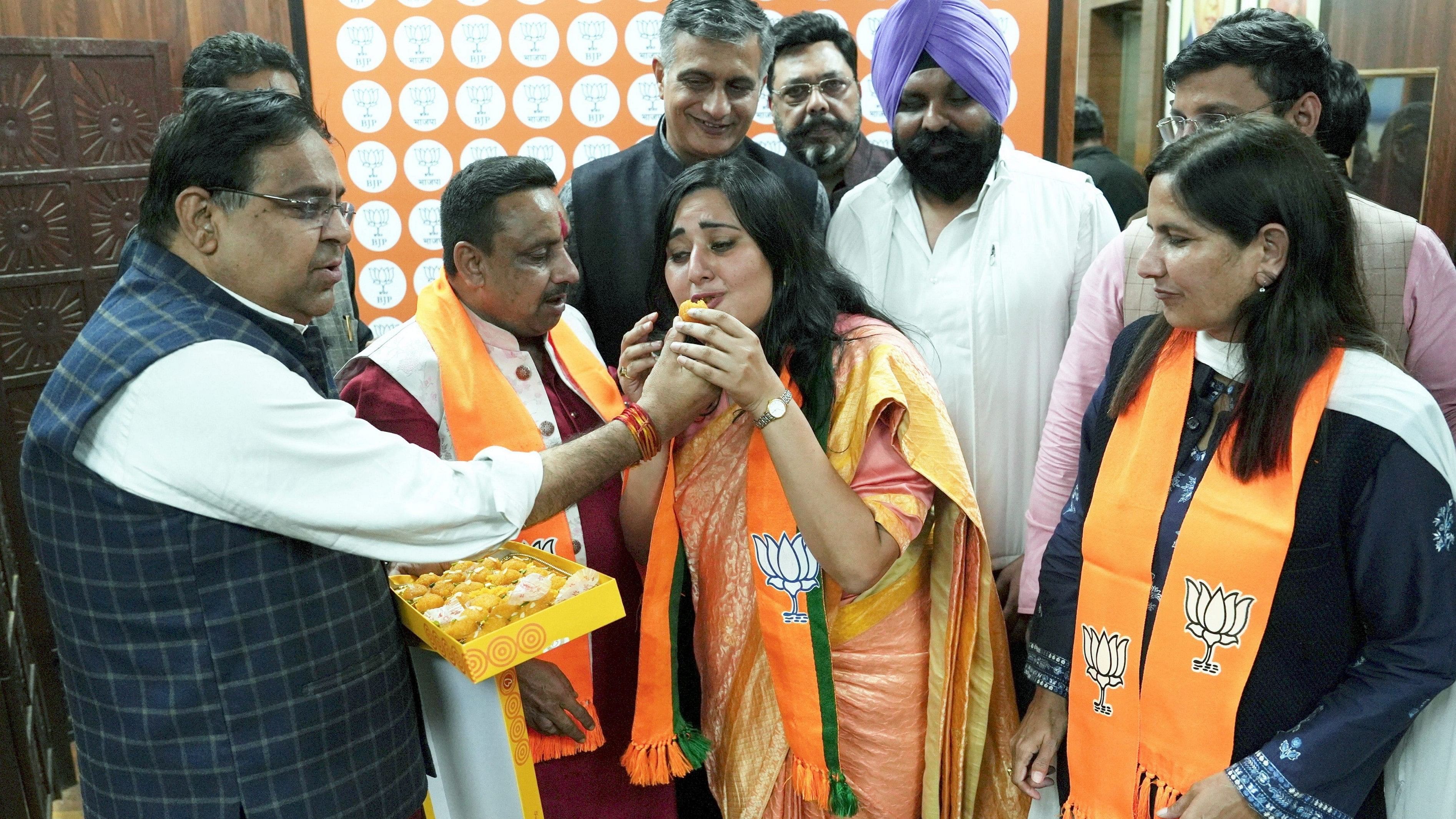 <div class="paragraphs"><p>BJP Delhi Spokesperson Harish Khurana offers sweets to the daughter of late BJP leader Sushma Swaraj and the party's Delhi Secretary Bansuri Swaraj after the latter was named in BJP's  first list of candidates for the upcoming Lok Sabha elections, in New Delhi.&nbsp;</p></div>