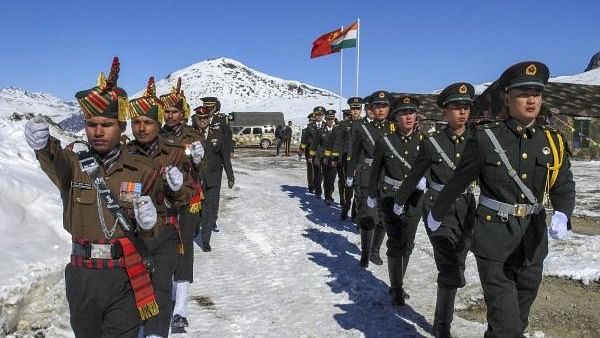 <div class="paragraphs"><p>Indian and Chinese soldiers jointly celebrate the New Year at Bumla along the Indo-China border in Arunachal Pradesh.</p></div>