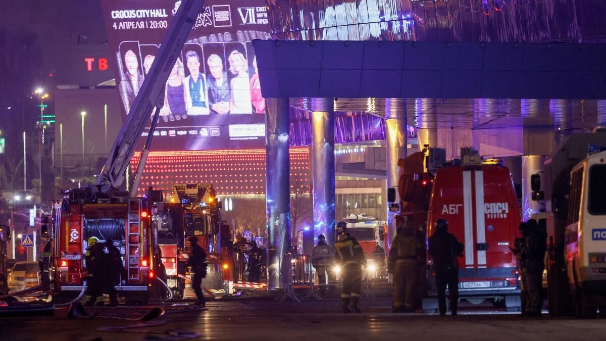 <div class="paragraphs"><p>Members of Russian emergency services work near the Crocus City Hall concert venue following a shooting incident, outside Moscow, Russia.</p></div>