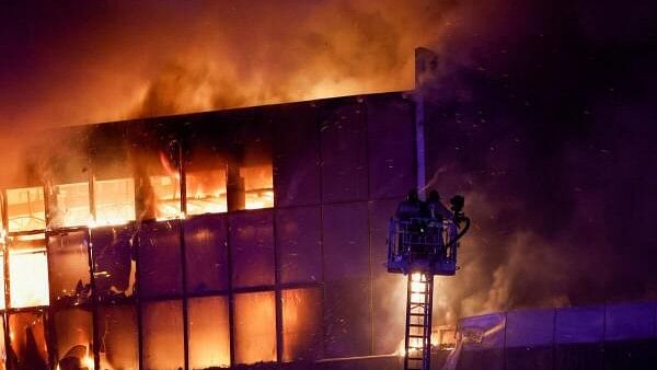 <div class="paragraphs"><p>Rescuers work to extinguish fire at the burning Crocus City Hall concert venue following a shooting incident, outside Moscow.</p></div>