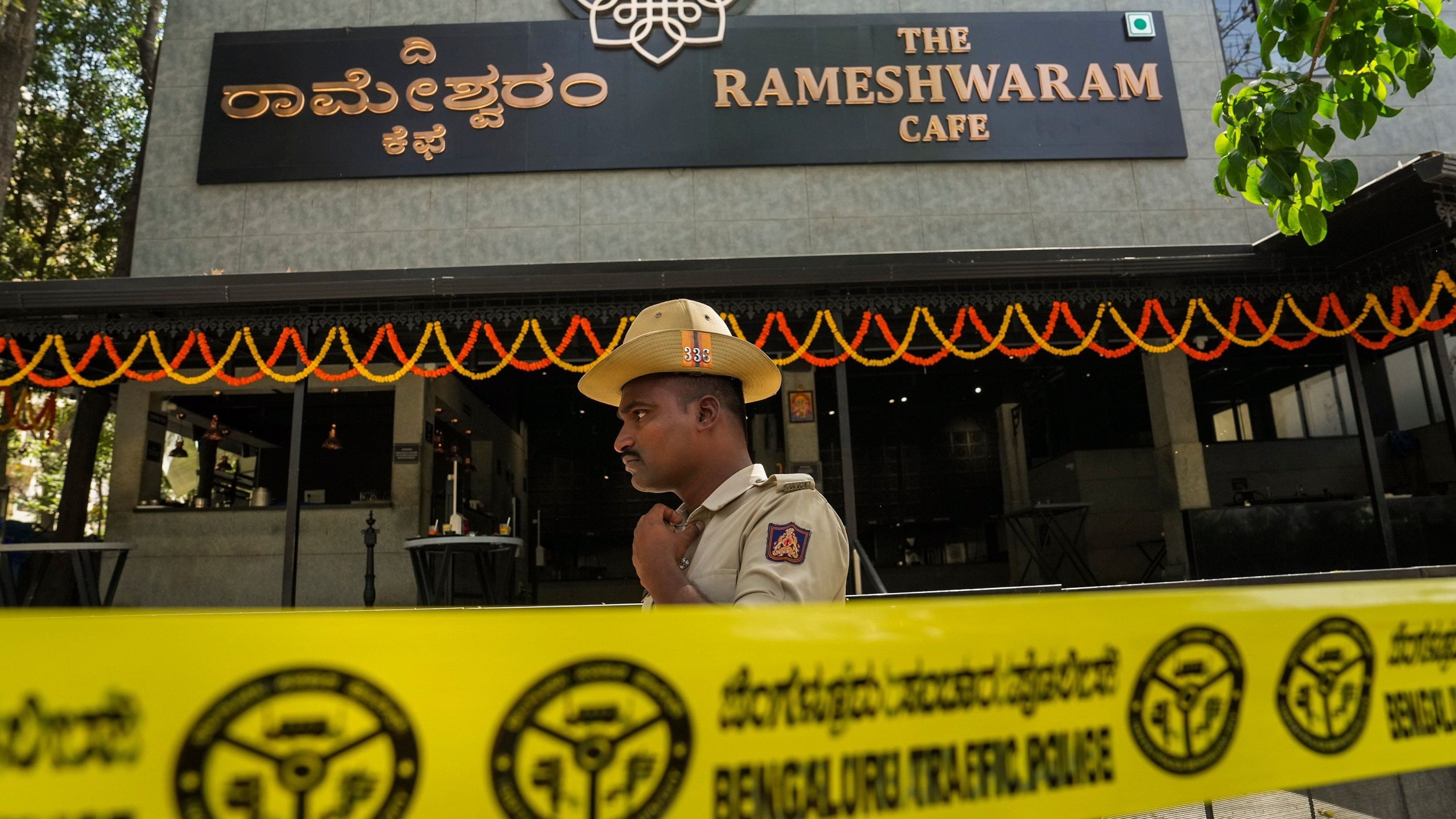 <div class="paragraphs"><p>A police official stands guard at the Rameshwaram cafe blast site, in Bengaluru, Saturday, March 2, 2024.</p></div>