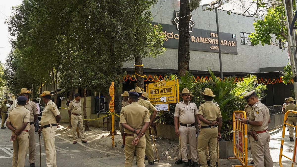 <div class="paragraphs"><p>Security personnel stand guard at the Rameshwaram Cafe blast site in Bengaluru.</p></div>