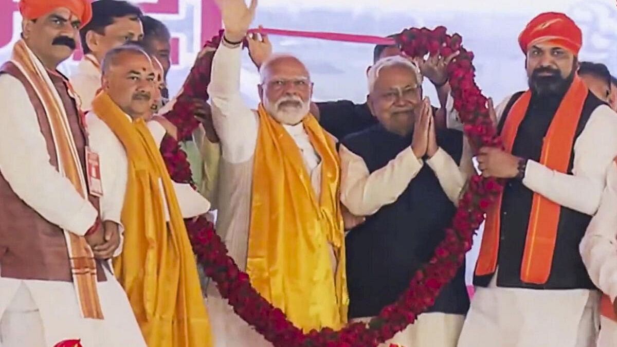 <div class="paragraphs"><p>Prime Minister Narendra Modi and Bihar Chief Minister Nitish Kumar being garlanded during a public gathering in Bihar's Aurangabad, Saturday, March 2, 2024.</p></div>