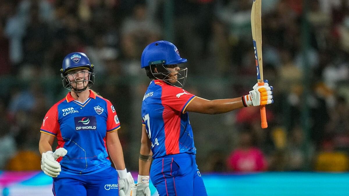 <div class="paragraphs"><p>Delhi Capitals' Shafali Verma celebrates with Alice Capsey after scoring a half century during a ‘Women’s Premier League (WPL) 2024’ T20 cricket match between Delhi Capitals and Royal Challengers Bangalore, at M Chinnaswamy Stadium, in Bengaluru, Thursday, Feb. 29, 2024.</p></div>