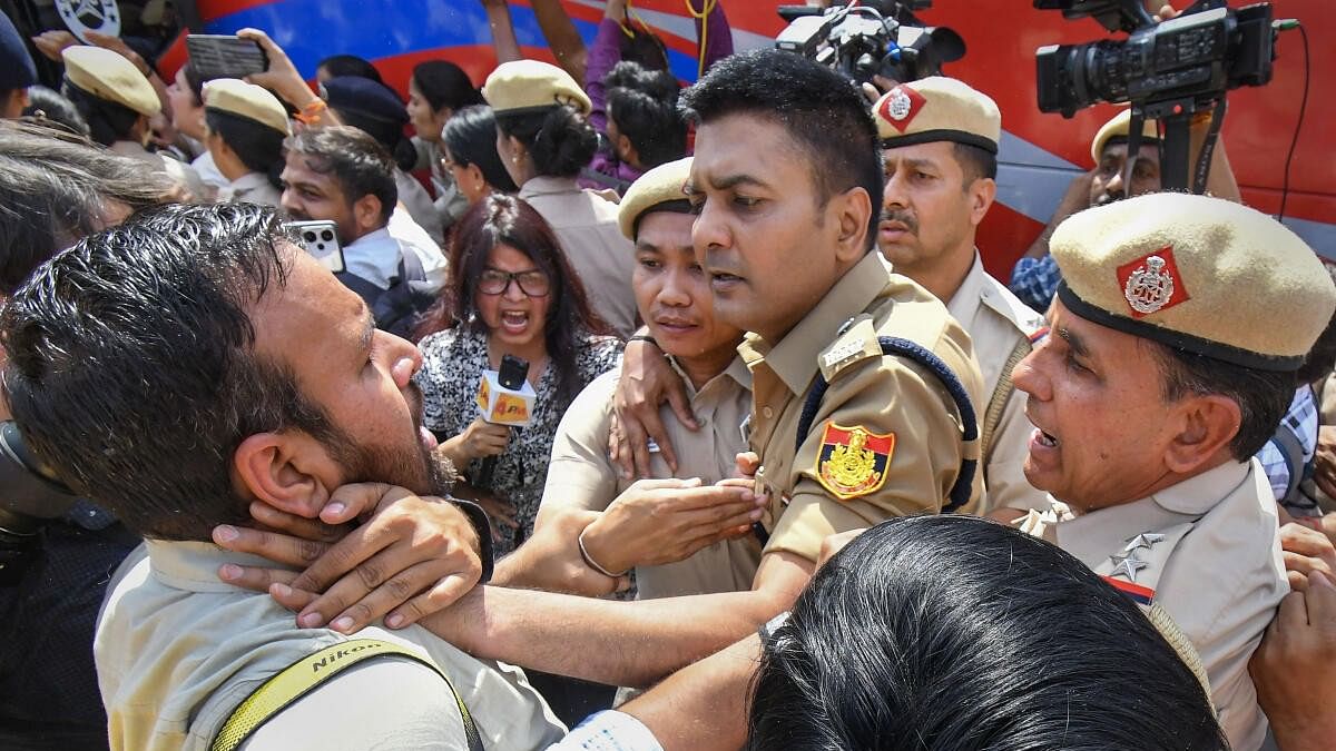 <div class="paragraphs"><p>A photojournalist manhandled by Delhi police personnel during protest by the Aam Aadmi Party over the arrest of Delhi Chief Minister Arvind Kejriwal by the ED, at Delhi’s Patel Chowk.</p></div>