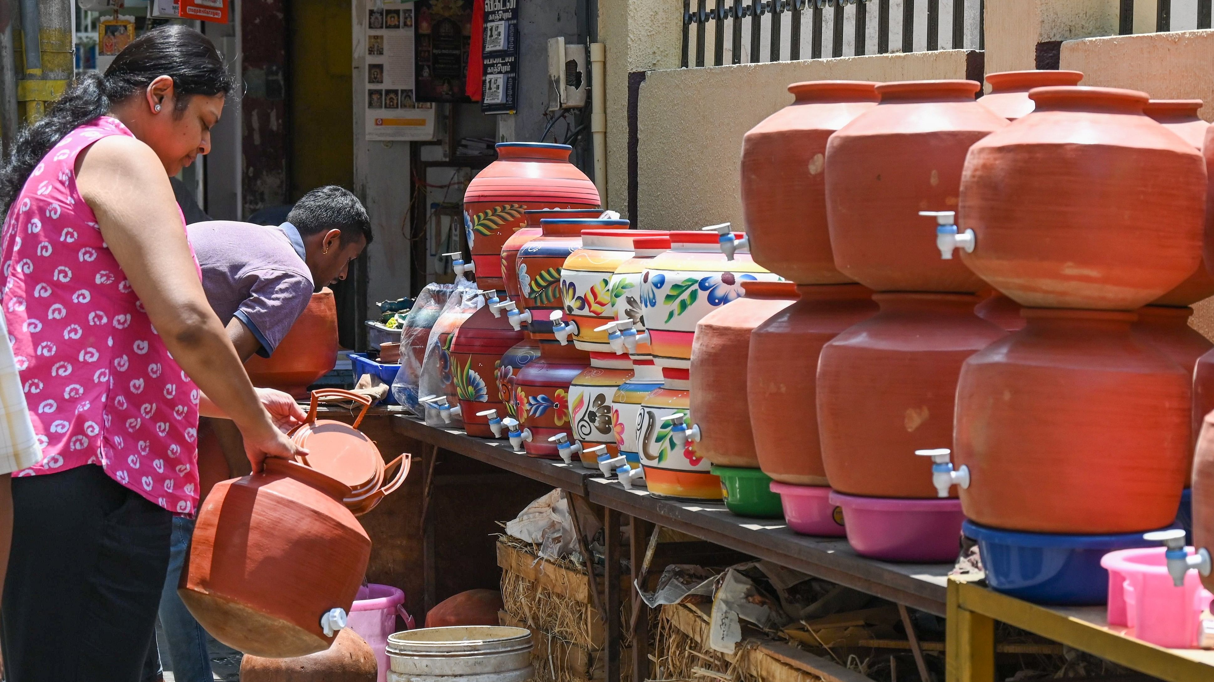 <div class="paragraphs"><p>Women buys clay pots to naturally cool drinking water during summer in Malleswaram on Saturday.&nbsp;</p></div>