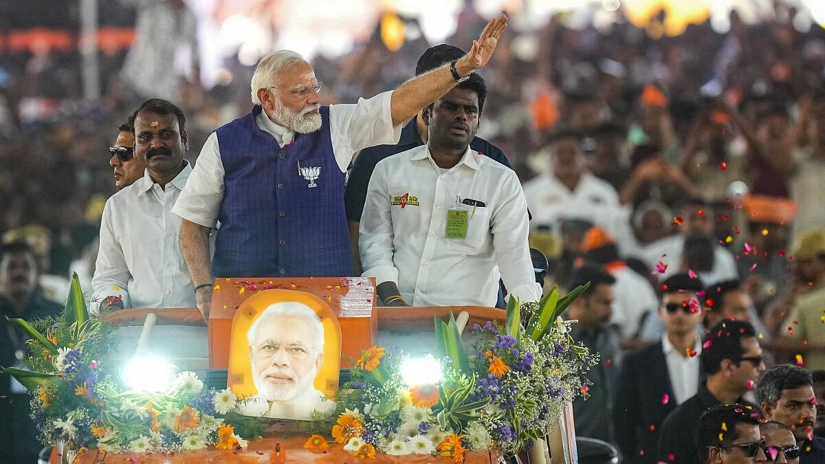 <div class="paragraphs"><p>Prime Minister Narendra Modi waves at supporters as he arrives for a public meeting ahead of Lok Sabha elections, in Salem, Tamil Nadu, Tuesday, March 19, 2024.</p></div>