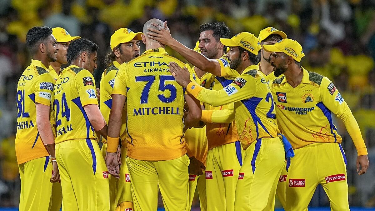 <div class="paragraphs"><p>Chennai Super Kings' Daryl Mitchell with teammates celebrates after taking the wicket of Gujarat Titans' Vijay Shankar during the IPL match in Chennai. </p></div>