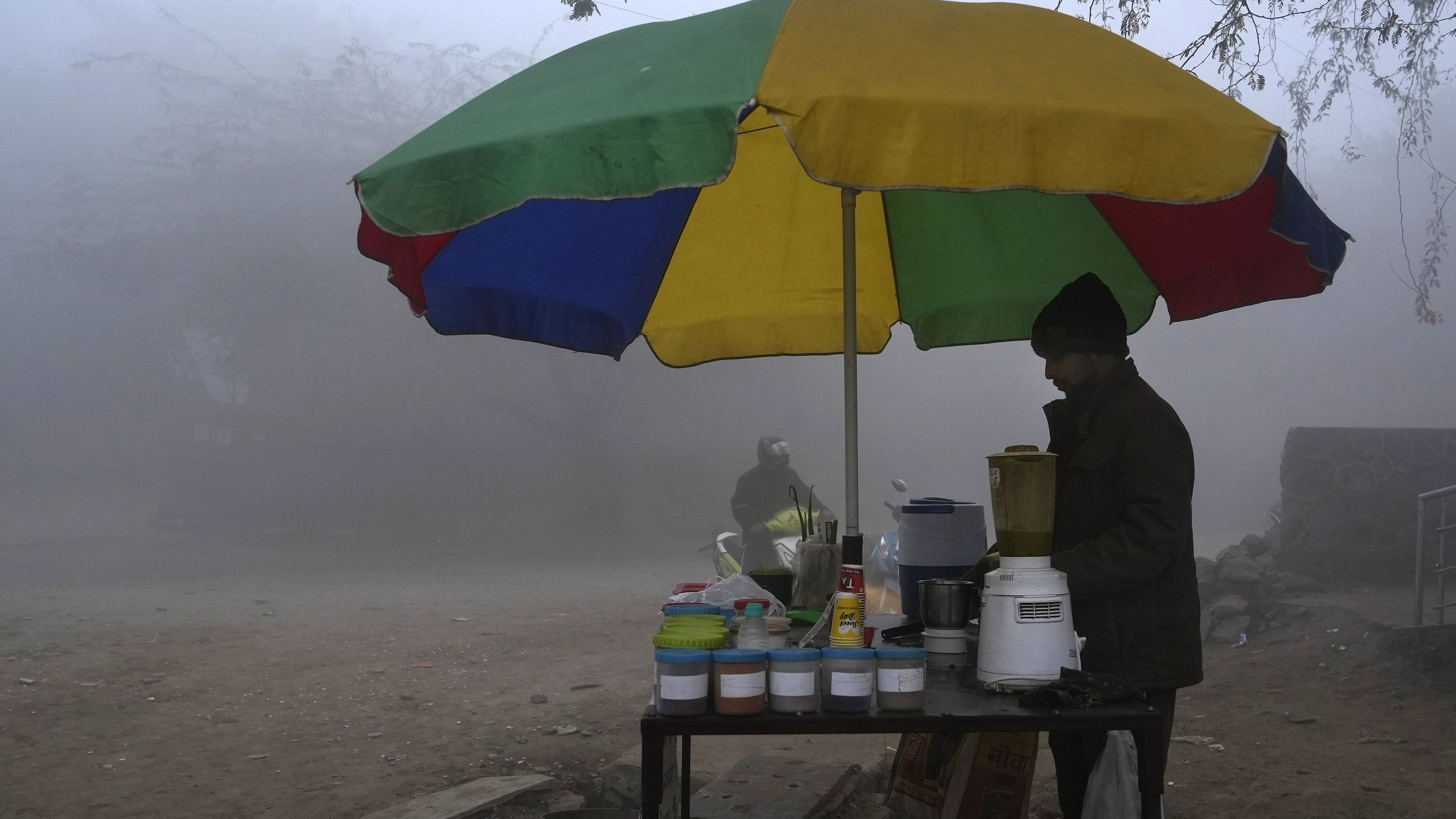 <div class="paragraphs"><p> A street vendor amid fog on a cold winter morning, in New Delhi, Jan. 14, 2024.</p></div>