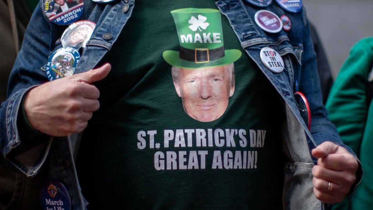 <div class="paragraphs"><p>A man wears a t-shirt depicting the face of former U.S. President Donald Trump as he attends the annual Saint Patrick's Day Parade on 5th Avenue in Manhattan, New York City, U.S., March 16, 2024.</p></div>