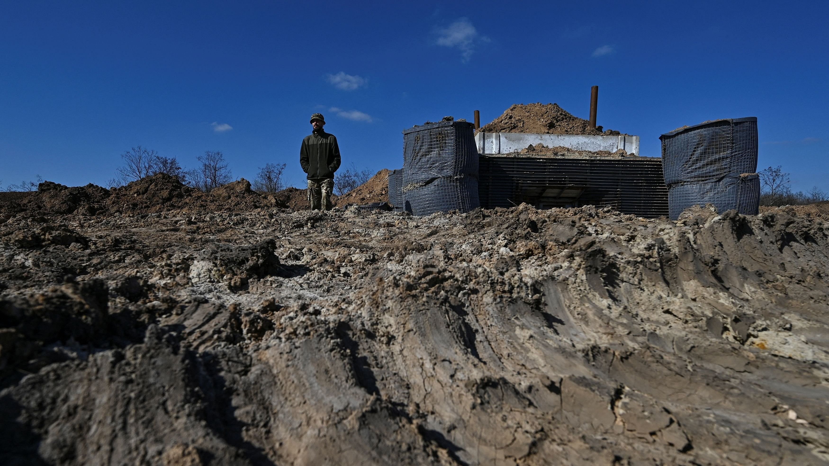 <div class="paragraphs"><p>Danylo, commander of an engineering and sapper company of the Ukrainian Armed Forces, stands next to a concrete dugout built as part of a system of new fortifications, amid Russia's attack on Ukraine, in Zaporizhzhia region, Ukraine March 11, 2024. </p></div>