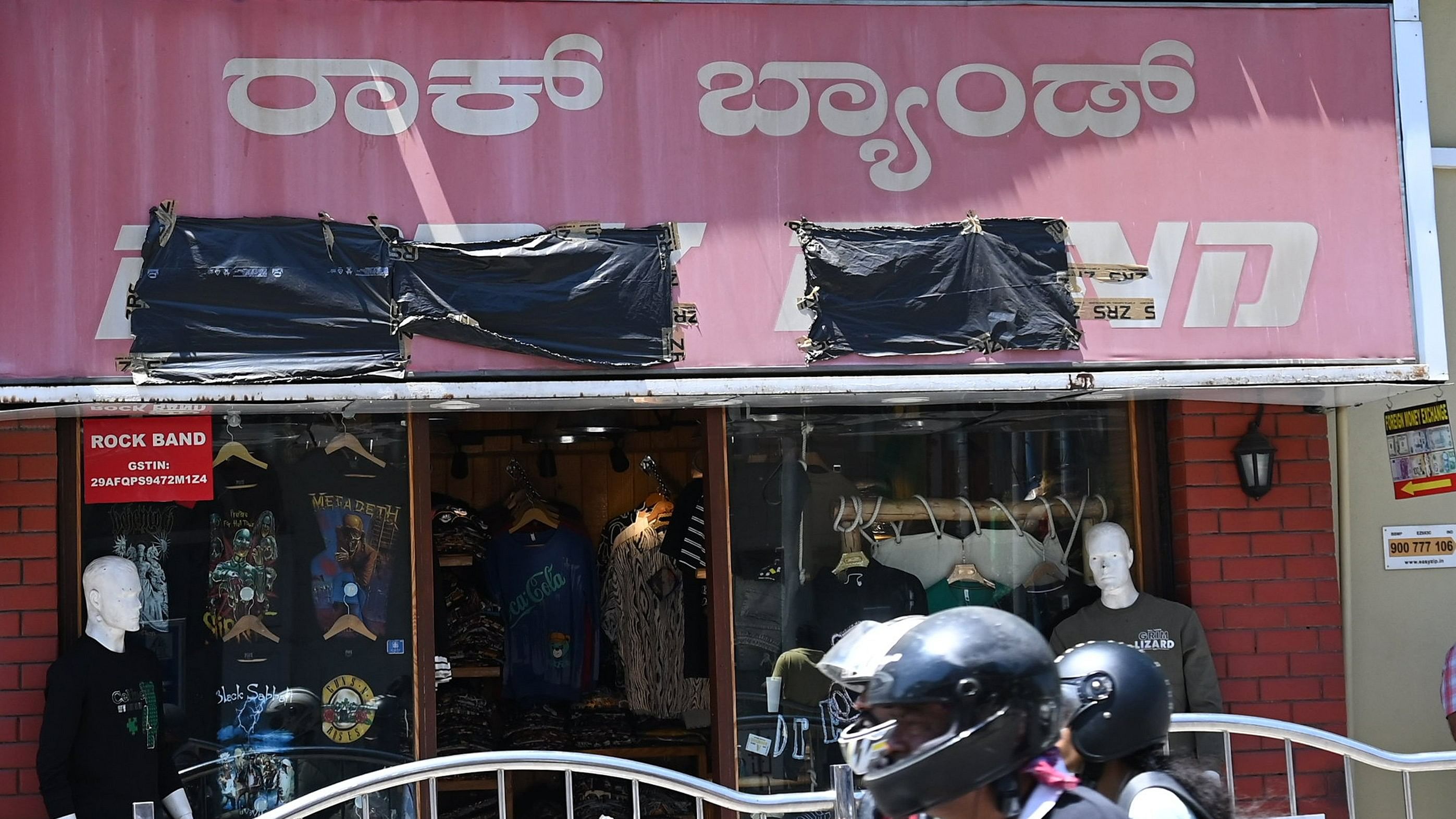 <div class="paragraphs"><p>Some shop owners are making temporary changes to their name boards to ensure compliance with the BBMP's rules. </p></div>