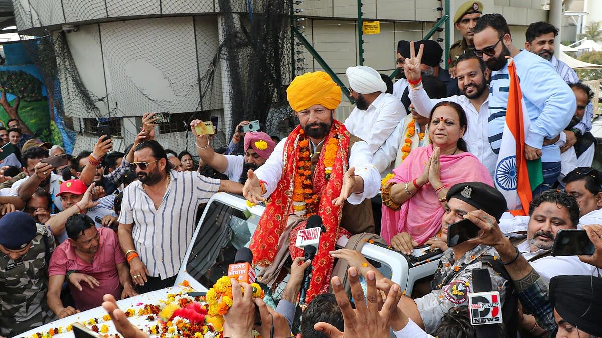<div class="paragraphs"><p>Newly joined Congress leader Lal Singh being welcomed by supporters upon his arrival at the airport, in Jammu.</p></div>