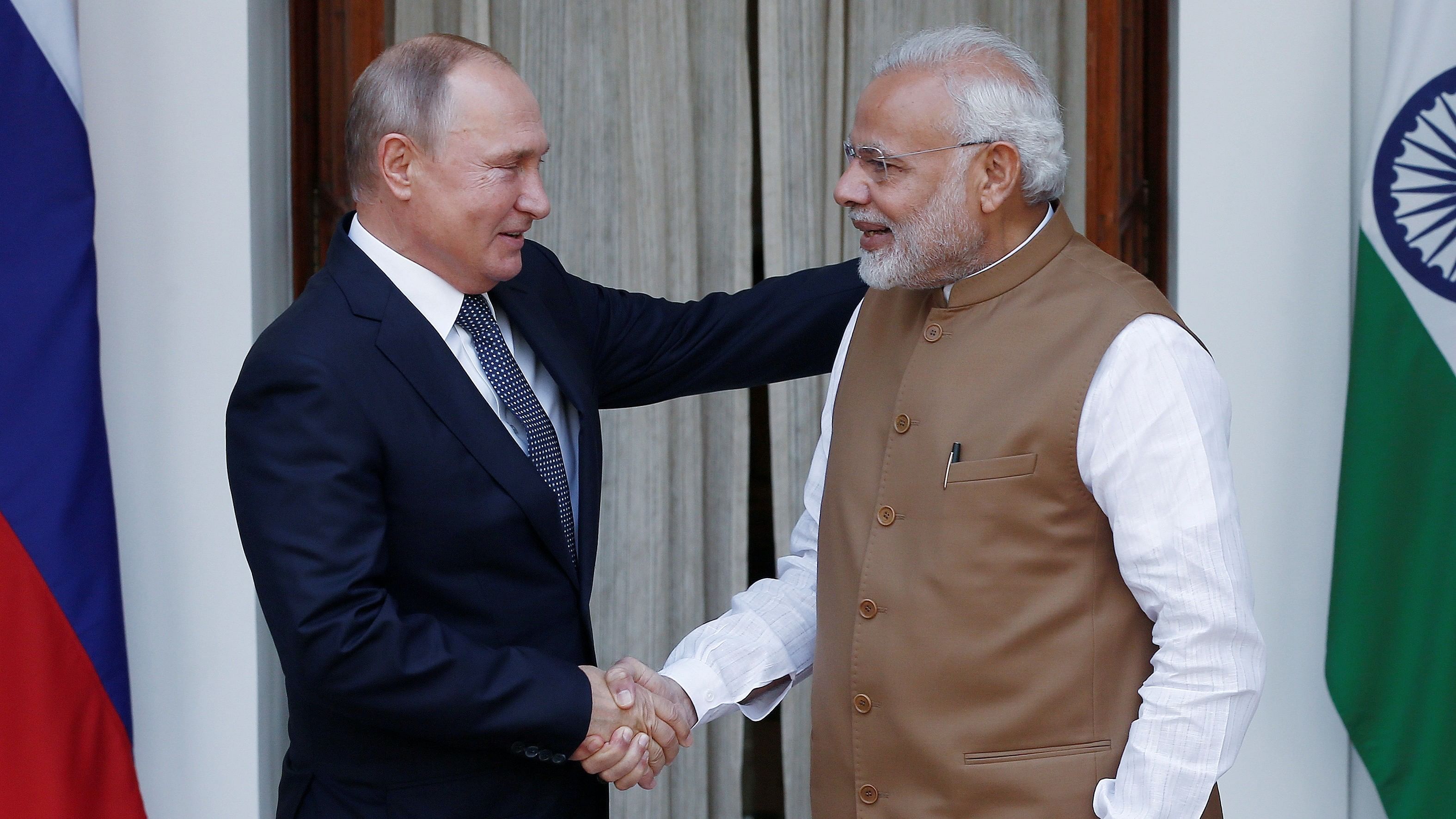 <div class="paragraphs"><p>File photo of&nbsp;Russian President Vladimir Putin shakes hands with India's Prime Minister Narendra Modi.</p></div>