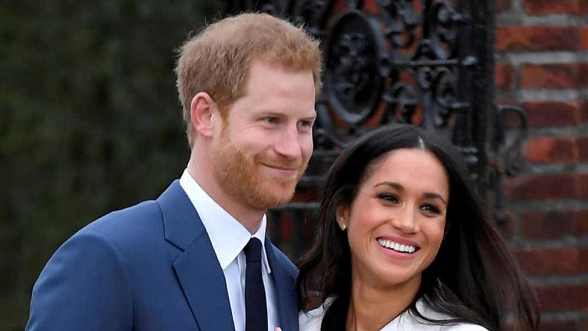 <div class="paragraphs"><p>Britain's Prince Harry poses with Meghan Markle in the Sunken Garden of Kensington Palace, London. </p></div>