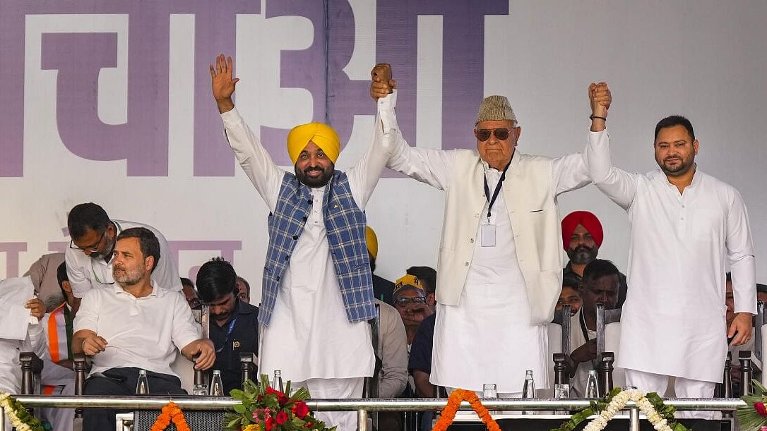 <div class="paragraphs"><p>Tejashwi Yadav (extreme right) joins hands with Punjab Chief Minister Bhagwant Mann, J&amp;K NC chief Farooq Abdulla as Rahul Gandhi looks on during the rally.</p></div>