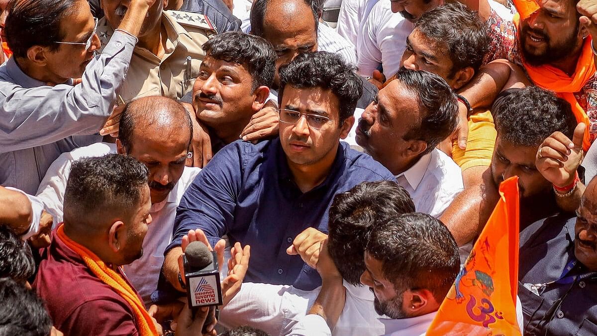 <div class="paragraphs"><p>Tejasvi Surya joins BJP workers in a protest after a shopkeeper was assaulted by a group of men for allegedly playing 'Hanuman Chalisa' over a loudspeaker in his shop during 'Azaan', at Nagarathpete, in Bengaluru.</p></div>