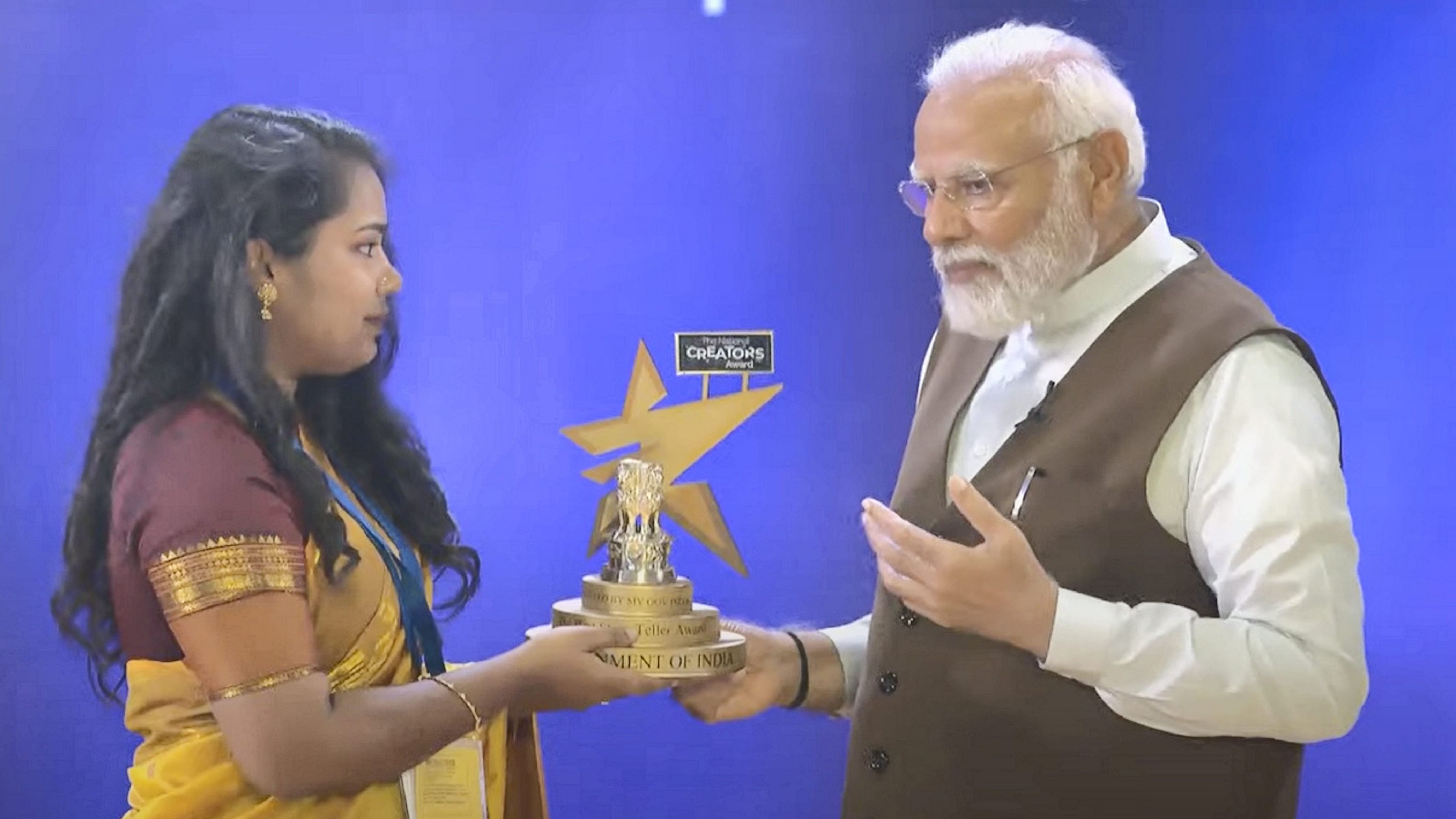 <div class="paragraphs"><p> Prime Minister Narendra Modi presenting a Creators Award during the National Creators Awards 2024, at Bharat Mandapam in New Delh</p></div>