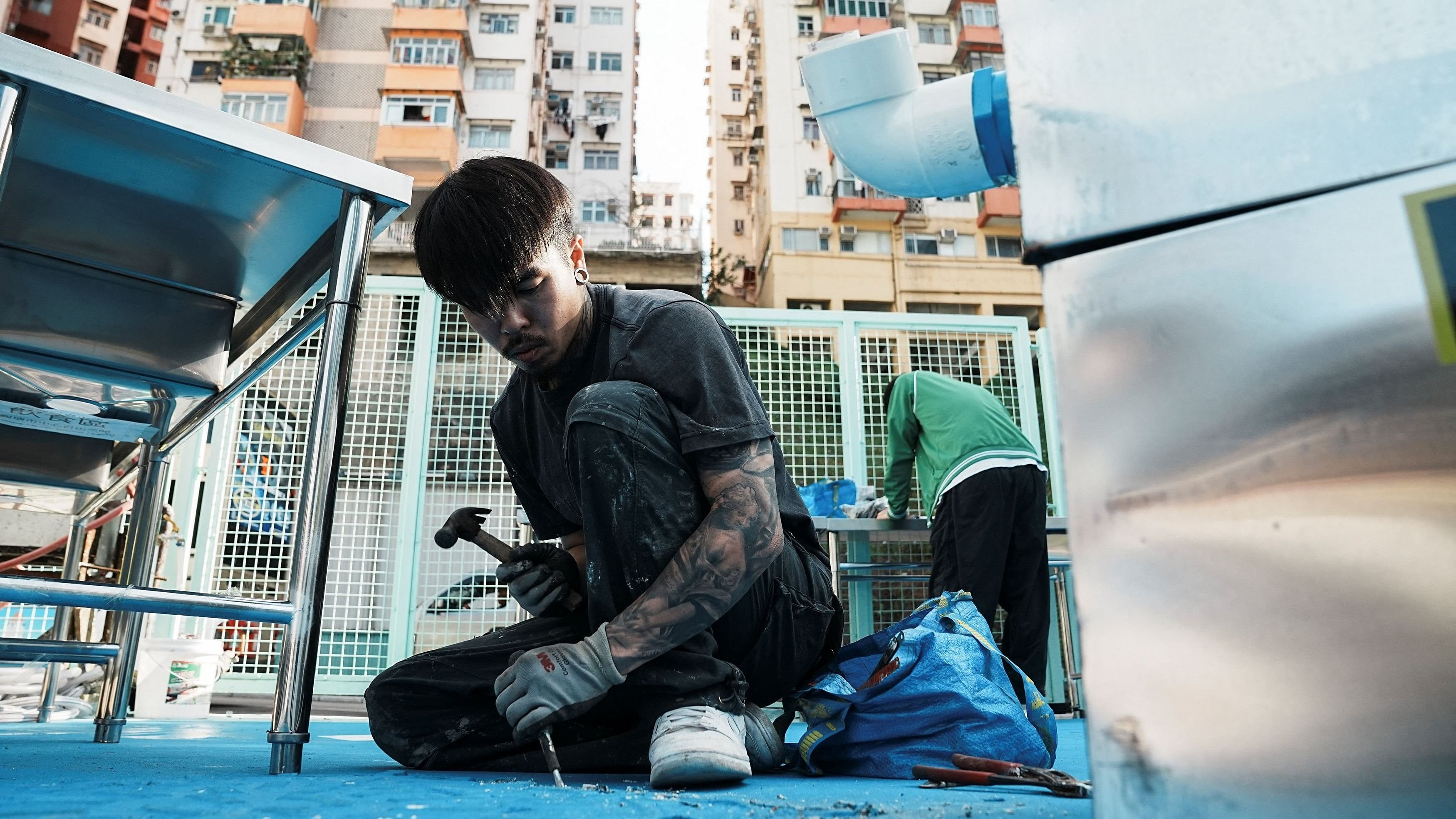 <div class="paragraphs"><p>A photo of breakdancer Cheung Cheuk-Man  works at a construction site in Hong Kong.</p></div>