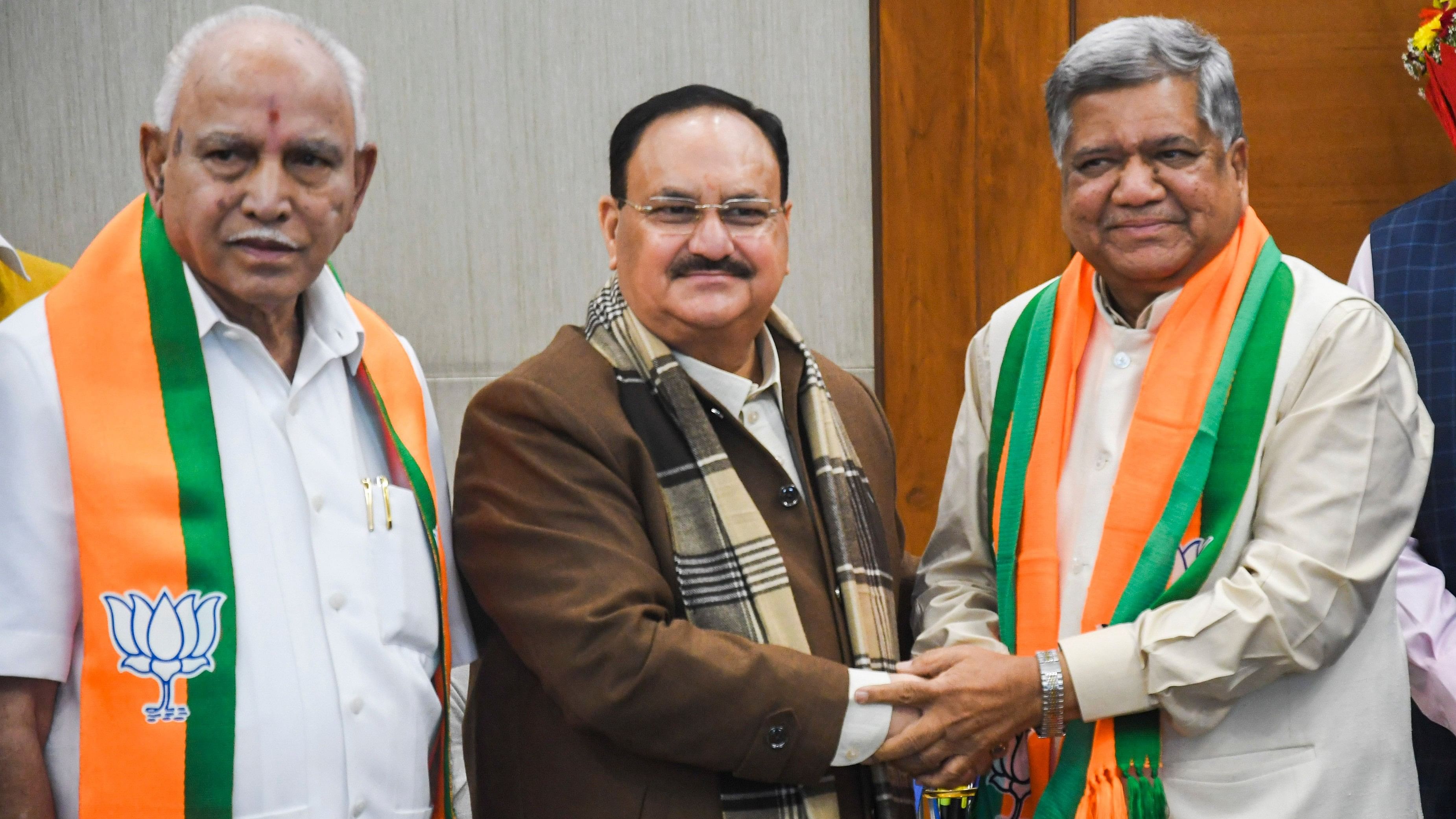 <div class="paragraphs"><p>Former Karnataka CM Jagadish Shettar with J P Nadda and B S Yediyurappa.</p></div>