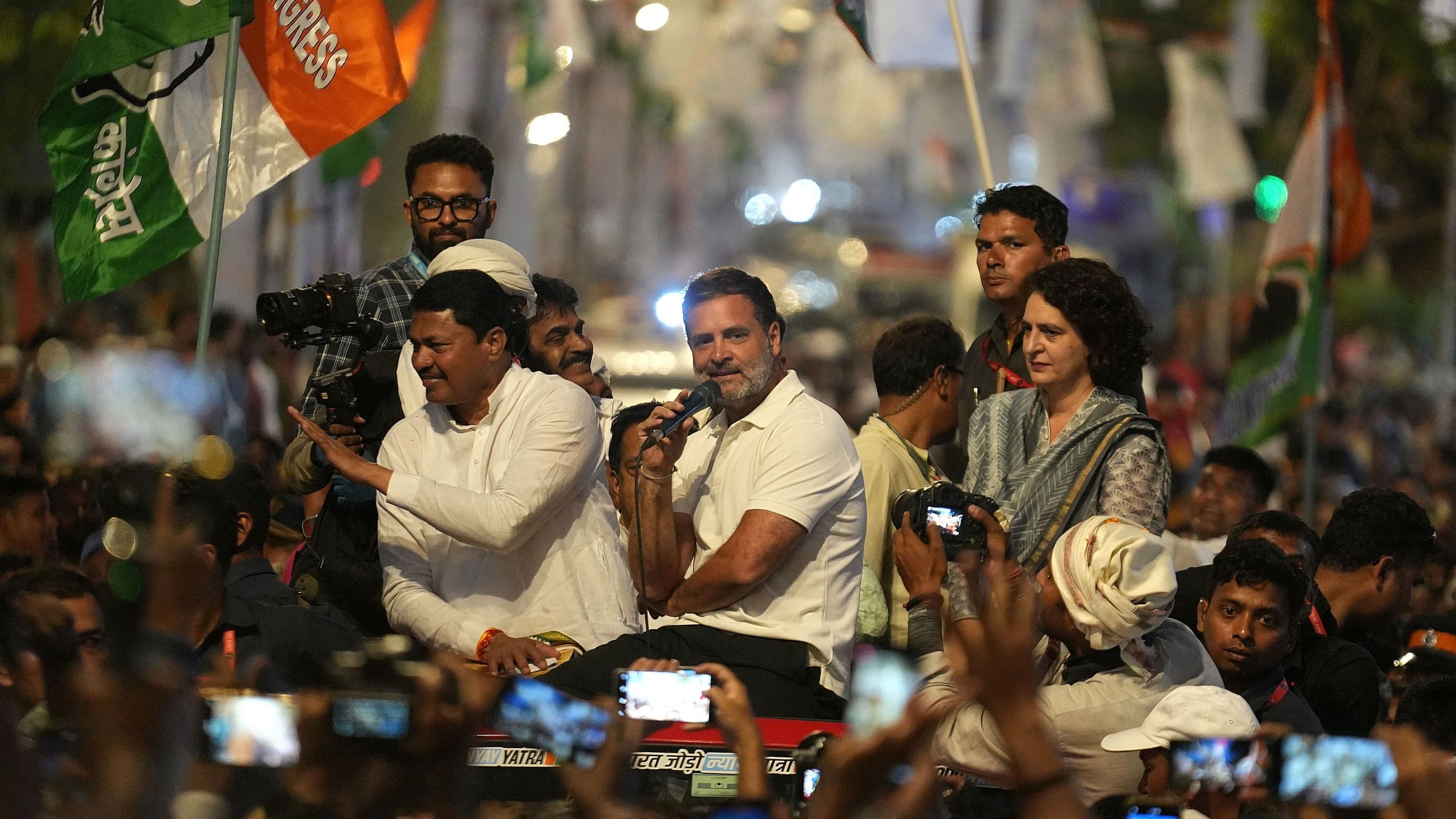 <div class="paragraphs"><p>Rahul Gandhi addresses his supporters as his sister and party leader Priyanka Gandhi Vadra looks on, at a roadshow during his 66-day long Bharat Jodo Nyay Yatra in Mumbai, March 16, 2024. </p></div>