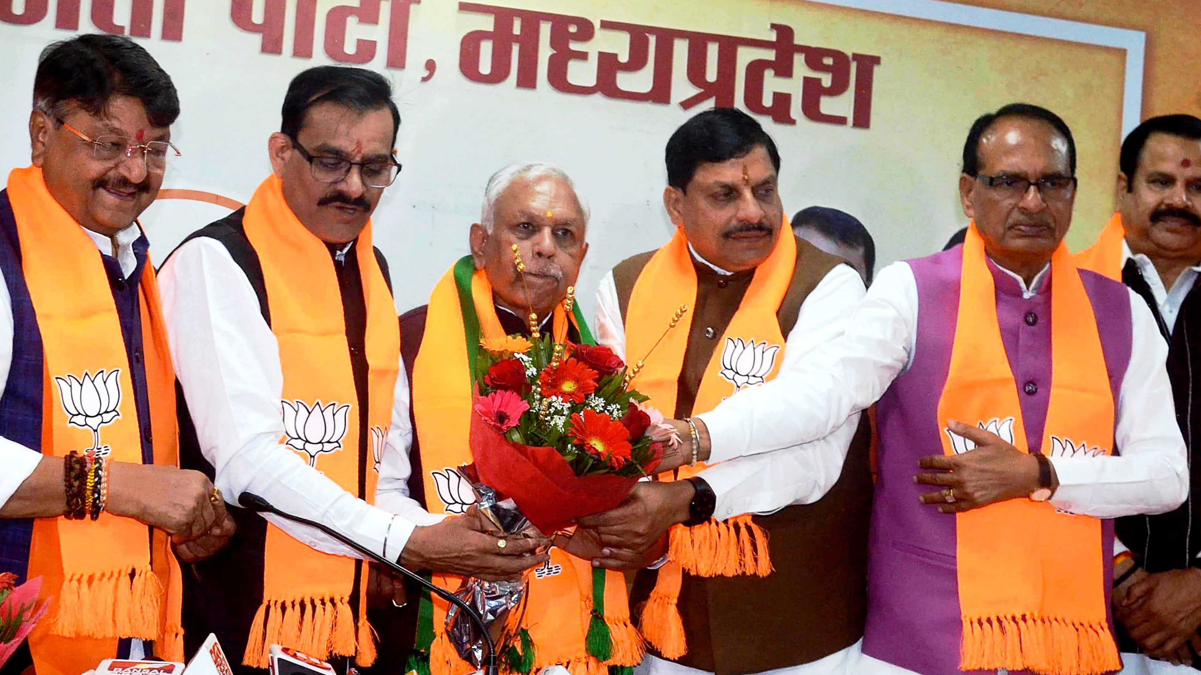 <div class="paragraphs"><p>Madhya Pradesh Chief Minister Mohan Yadav, former CM Shivraj Singh Chouhan and BJP state President V D Sharma welcome senior Congress leader and former Union Minister Suresh Pachouri as he joins BJP, at BJP office, in Bhopal, Saturday, March 9, 2024. </p></div>