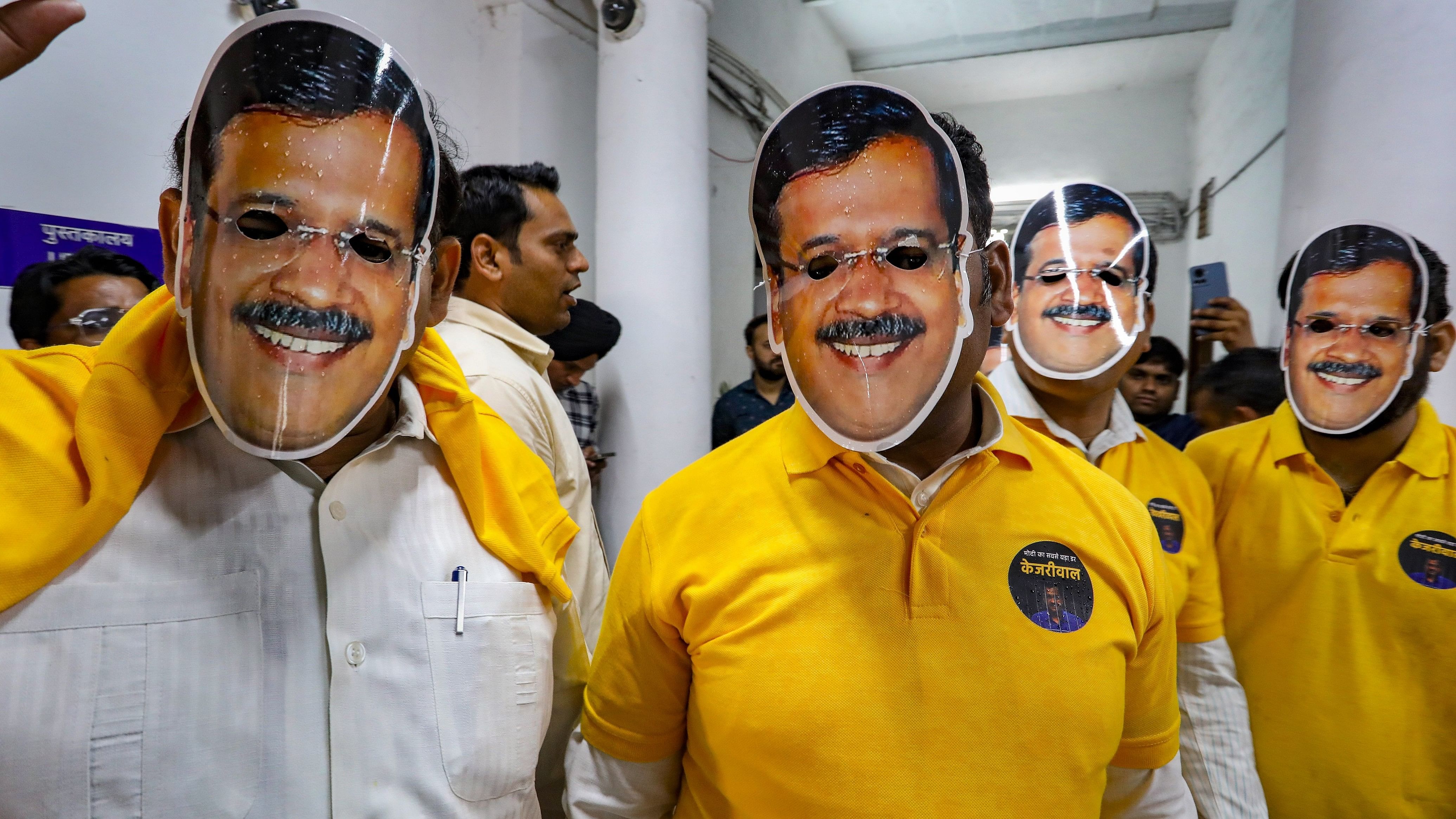 <div class="paragraphs"><p>AAP MLAs wear masks of Chief Minister Arvind Kejriwal during their protest against CM's arrest, at the Delhi Legislative Assembly, in New Delhi, on Wednesday.</p></div>