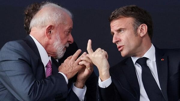 <div class="paragraphs"><p>Brazil's President Luiz Inacio Lula da Silva and French President Emmanuel Macron speak as they attend the launching of the third Scorpene-class diesel-powered submarine built in Brazil with French technology, at the Itaguai shipyard in Rio de Janeiro state, Brazil March 27, 2024.</p></div>