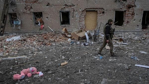 <div class="paragraphs"><p>A soldier walks near destroyed building, amid Russia's attack on Ukraine, in the frontline town of Chasiv Yar in Donetsk region, Ukraine March 5, 2024.</p></div>