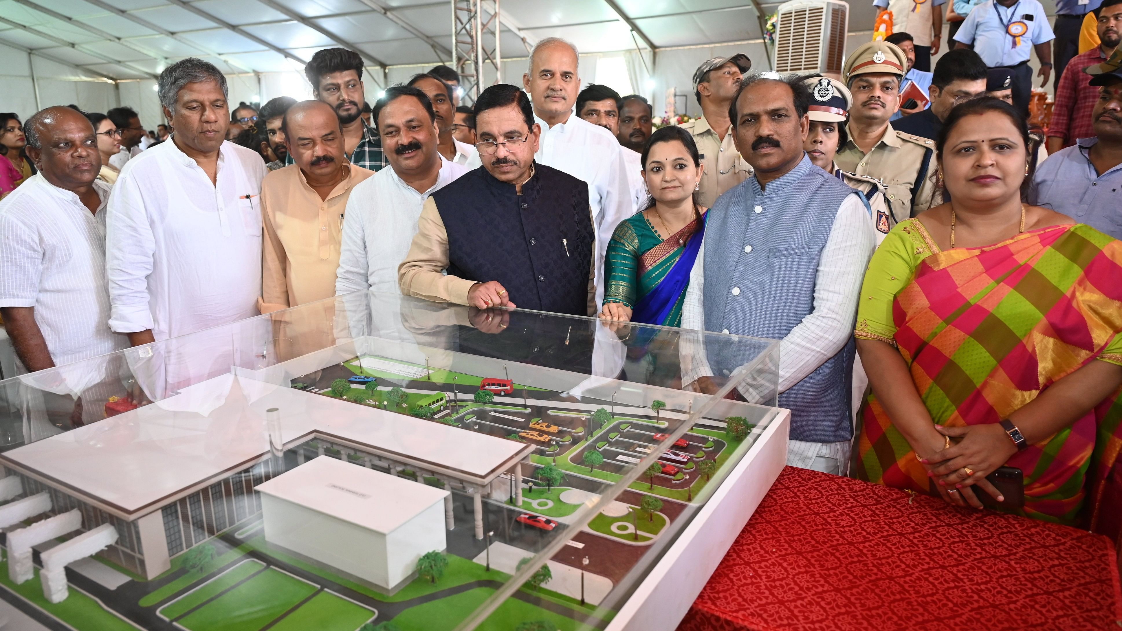<div class="paragraphs"><p>Union Minister Pralhad Joshi inspects the model of the proposed new terminal building of Hubballi Airport in Hubballi on Sunday, March 10, 2024.</p></div>