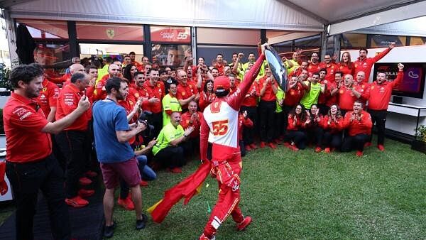 <div class="paragraphs"><p>Ferrari's Carlos Sainz Jr. celebrates with the trophy after winning the Australian Grand Prix.</p></div>